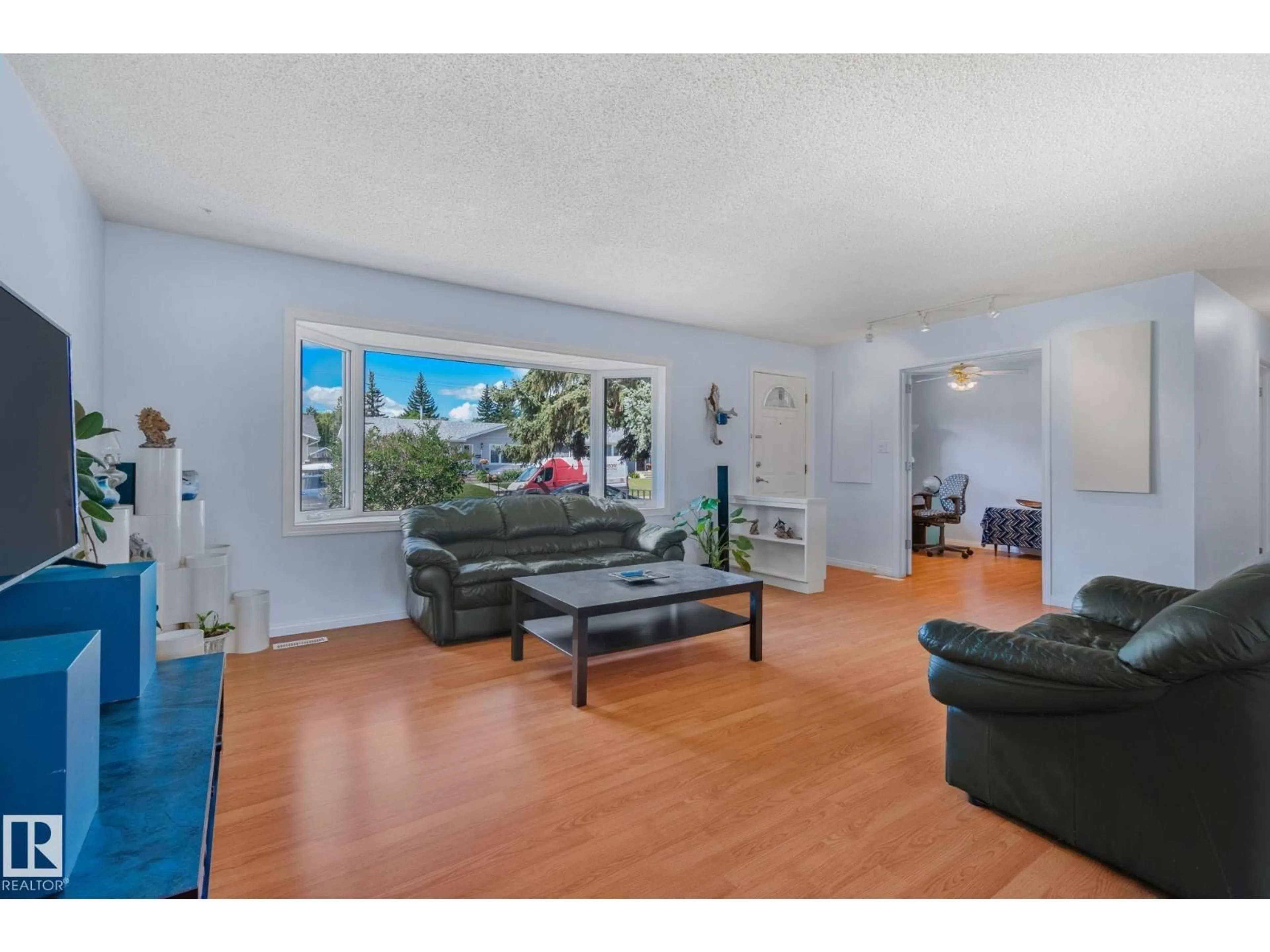 Living room with furniture, wood/laminate floor for 14815 96 ST, Edmonton Alberta T5E4B9