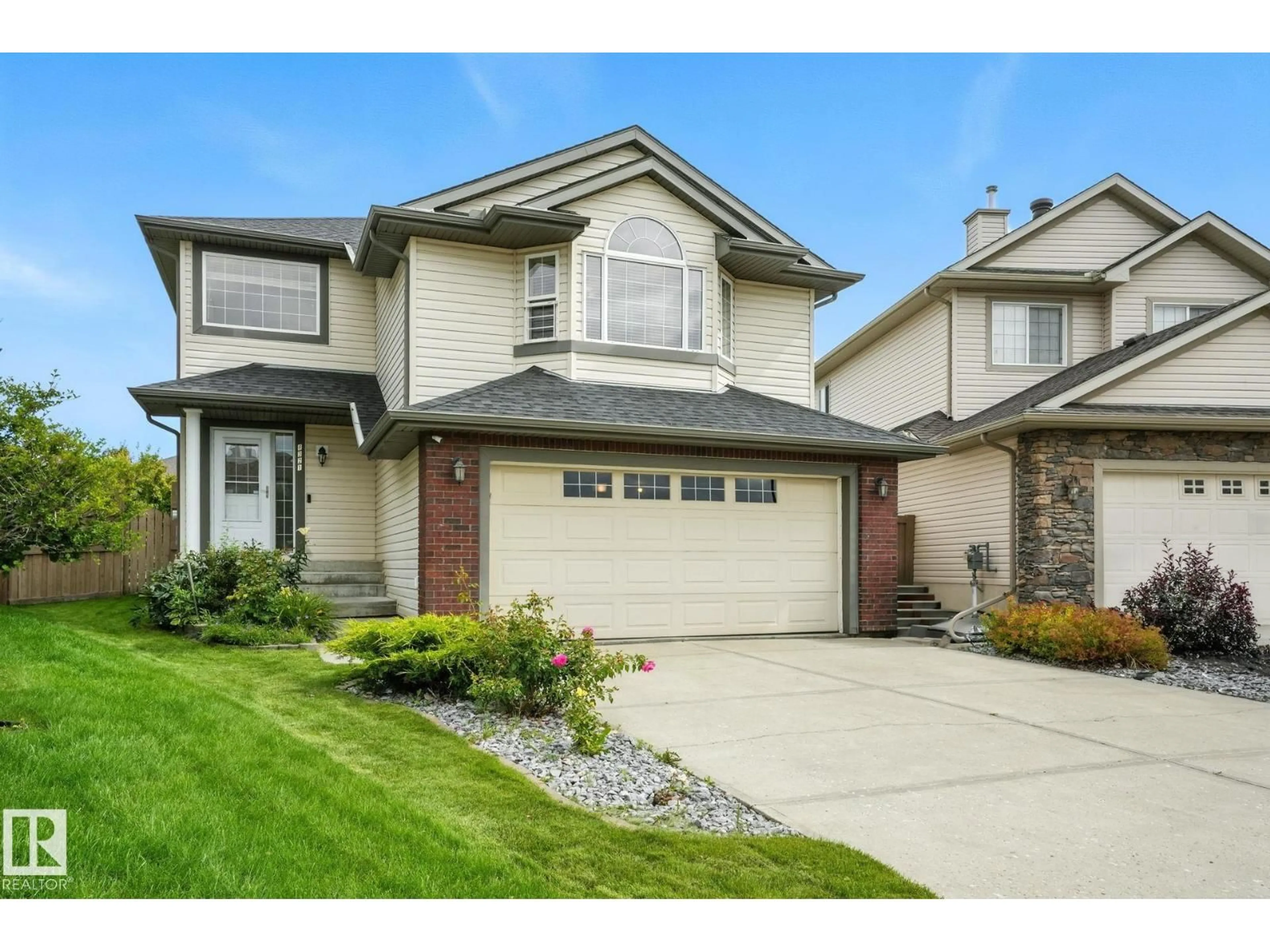 Home with vinyl exterior material, street for 8321 SHASKE CR, Edmonton Alberta T6R3V8