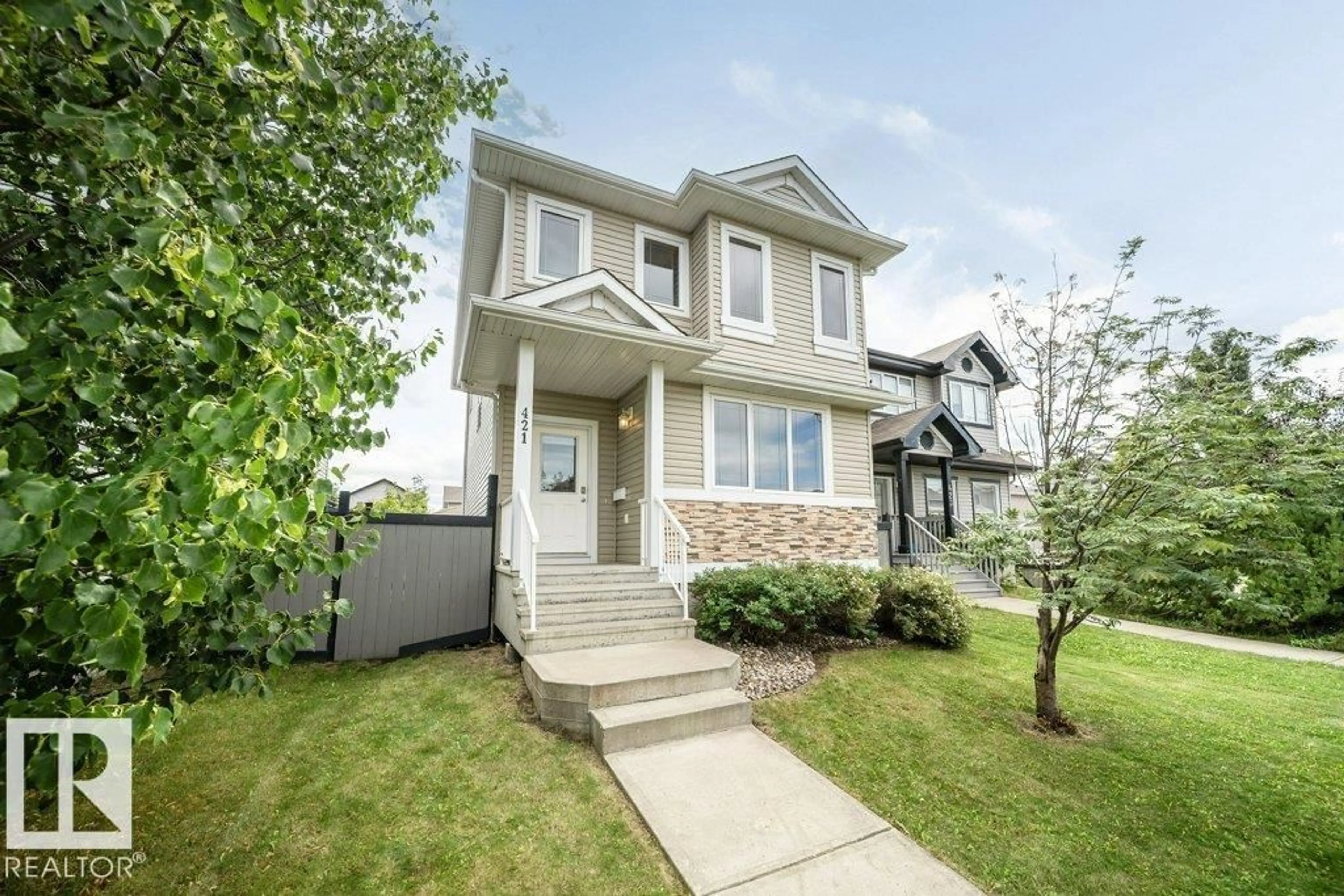 Home with vinyl exterior material, street for 421 KEYSTONE WY, Leduc Alberta T9E0M5