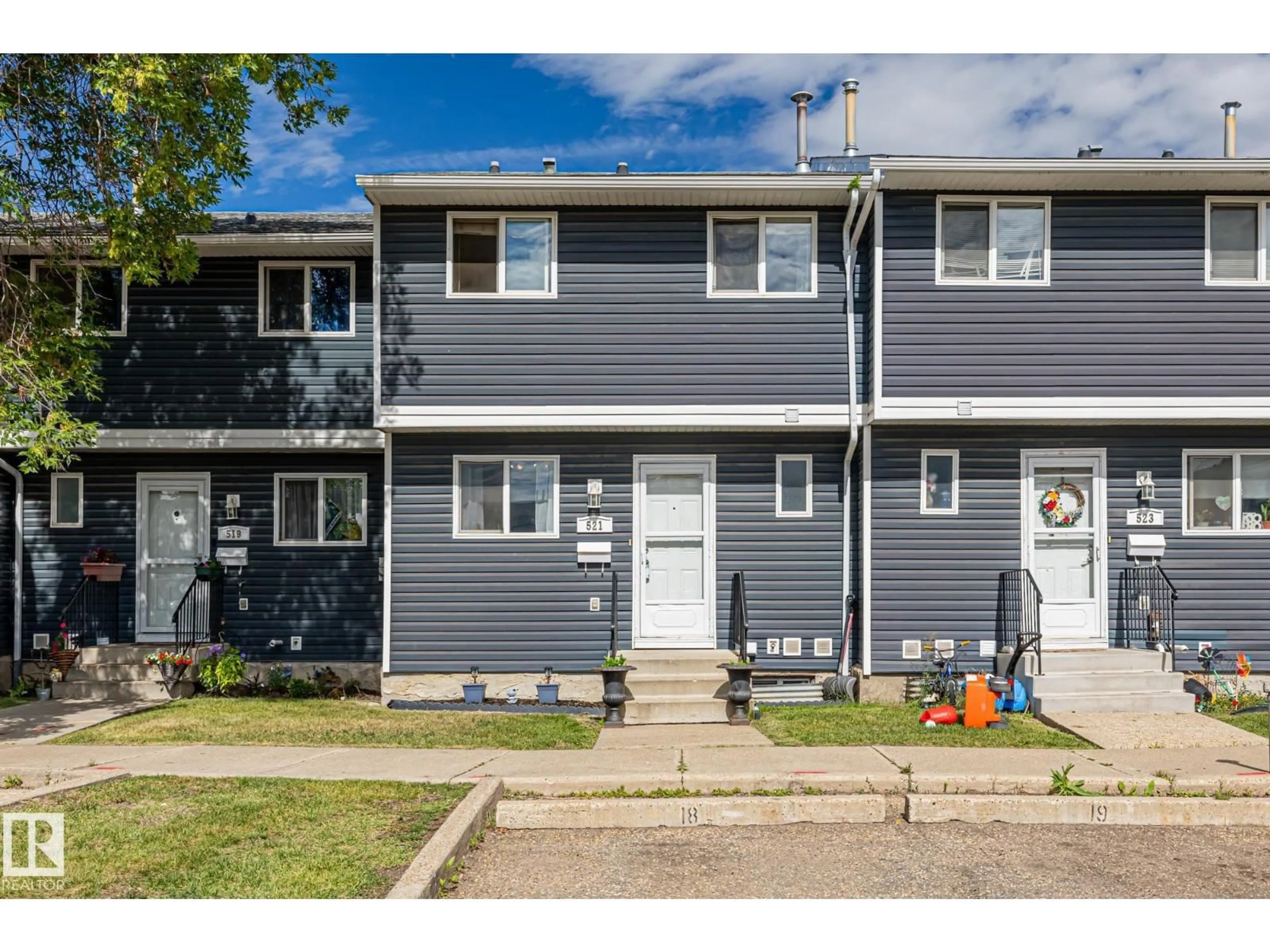 Home with vinyl exterior material, street for 521 DUNLUCE RD, Edmonton Alberta T5X4P4