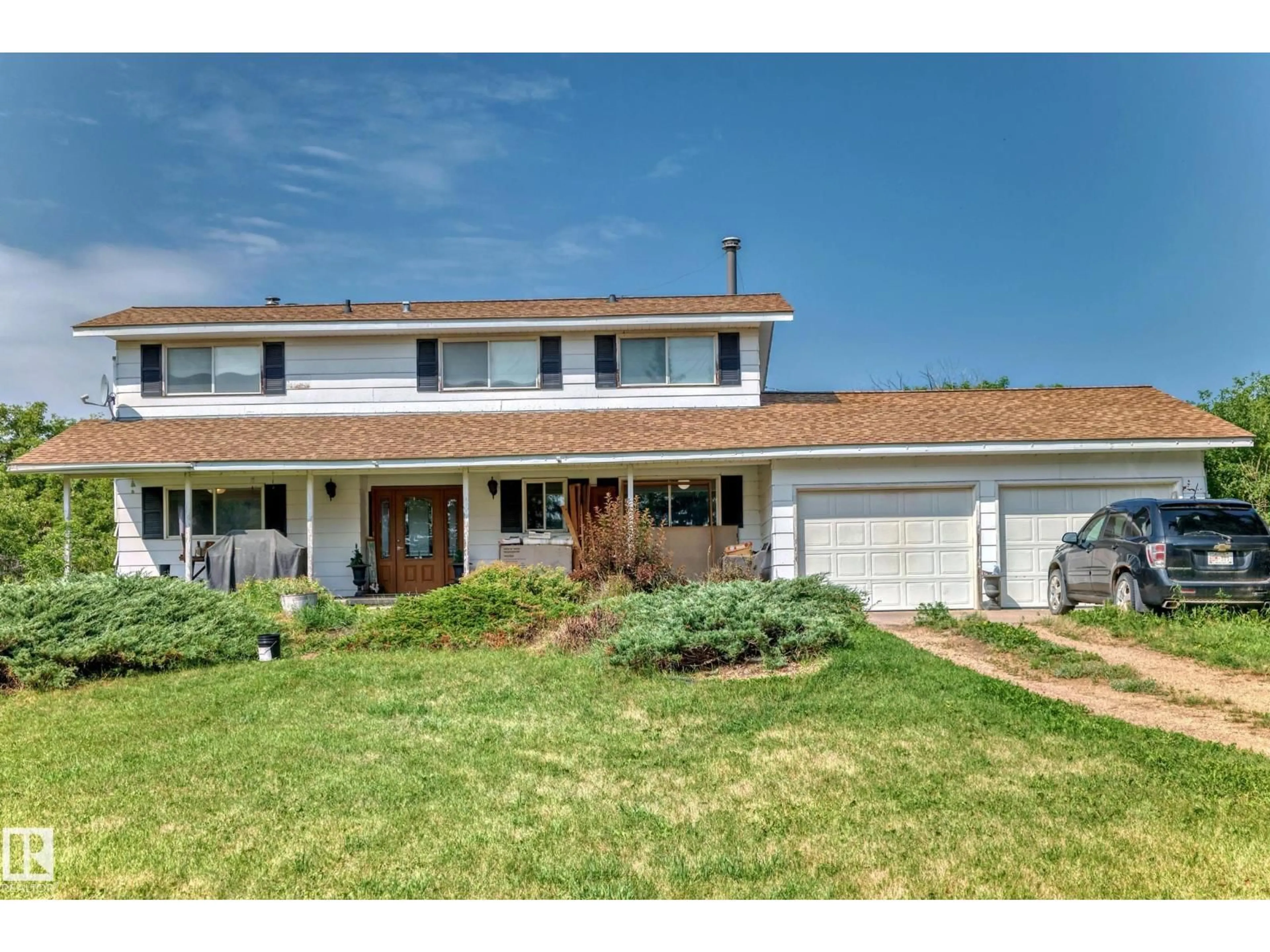 Home with vinyl exterior material, street for 50256 RGE RD 11, Rural Leduc County Alberta T0C2P0