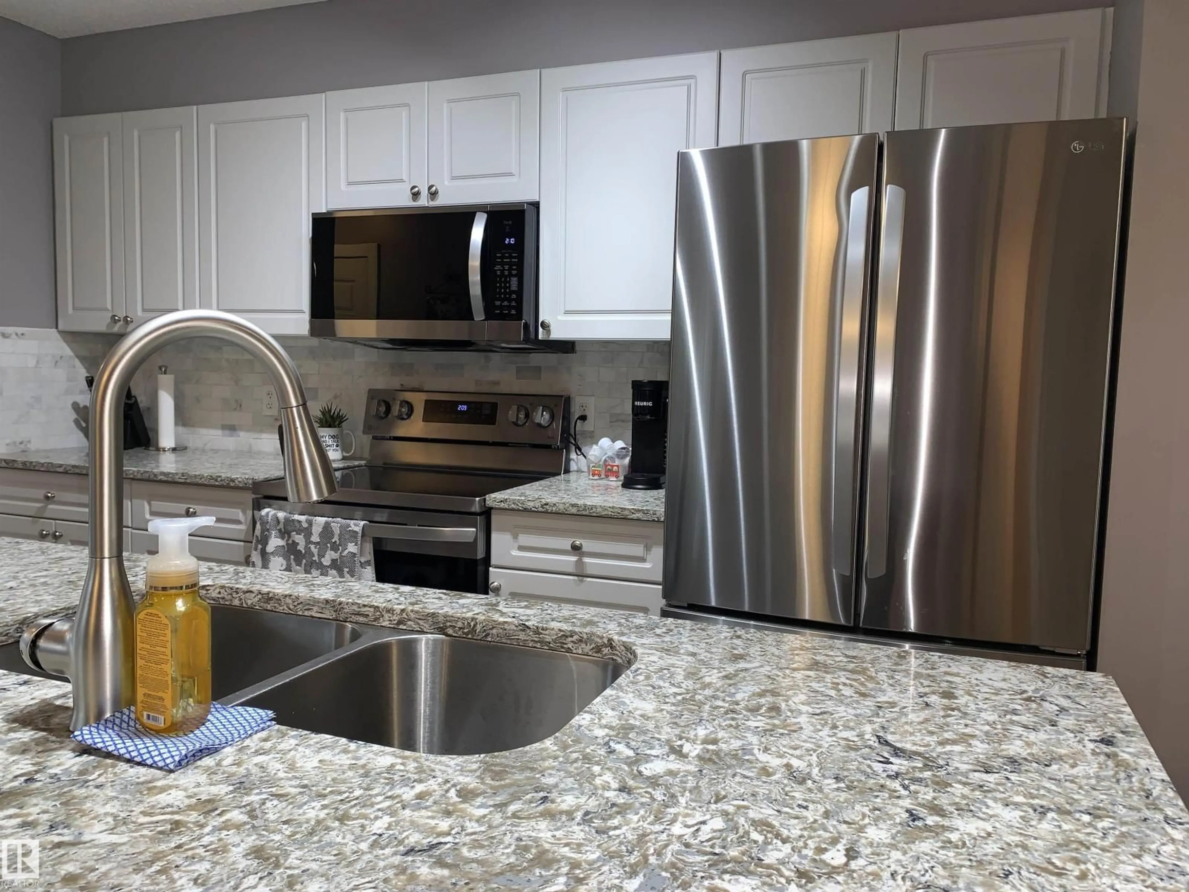 Open concept kitchen, ceramic/tile floor for 3818 ALLAN DR, Edmonton Alberta T6W0S7