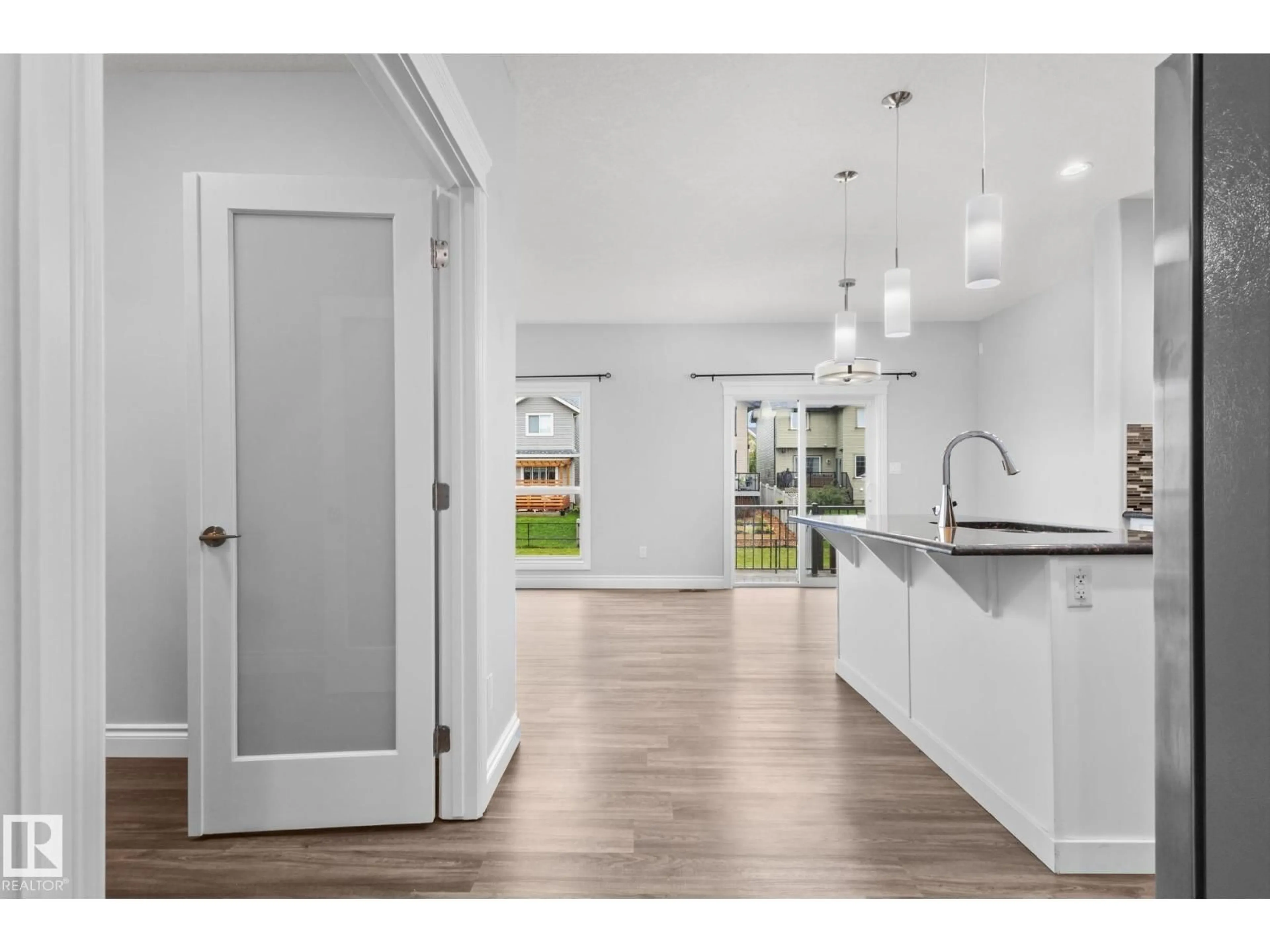 Open concept kitchen, wood/laminate floor for 4648 CHARLES WY, Edmonton Alberta T6W3H1