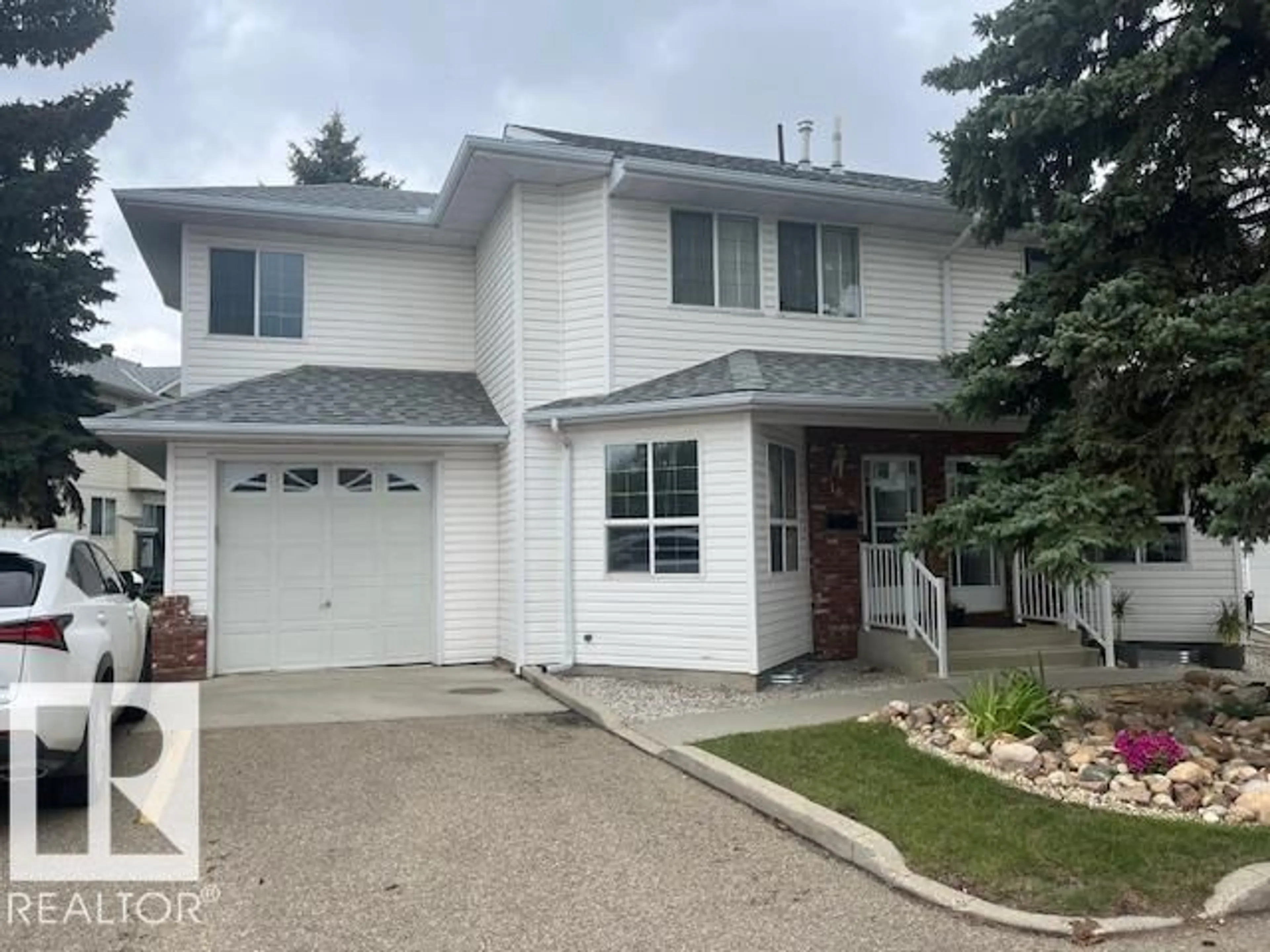 Home with vinyl exterior material, street for 1033 - 16 YOUVILLE DR, Edmonton Alberta T6L6V9