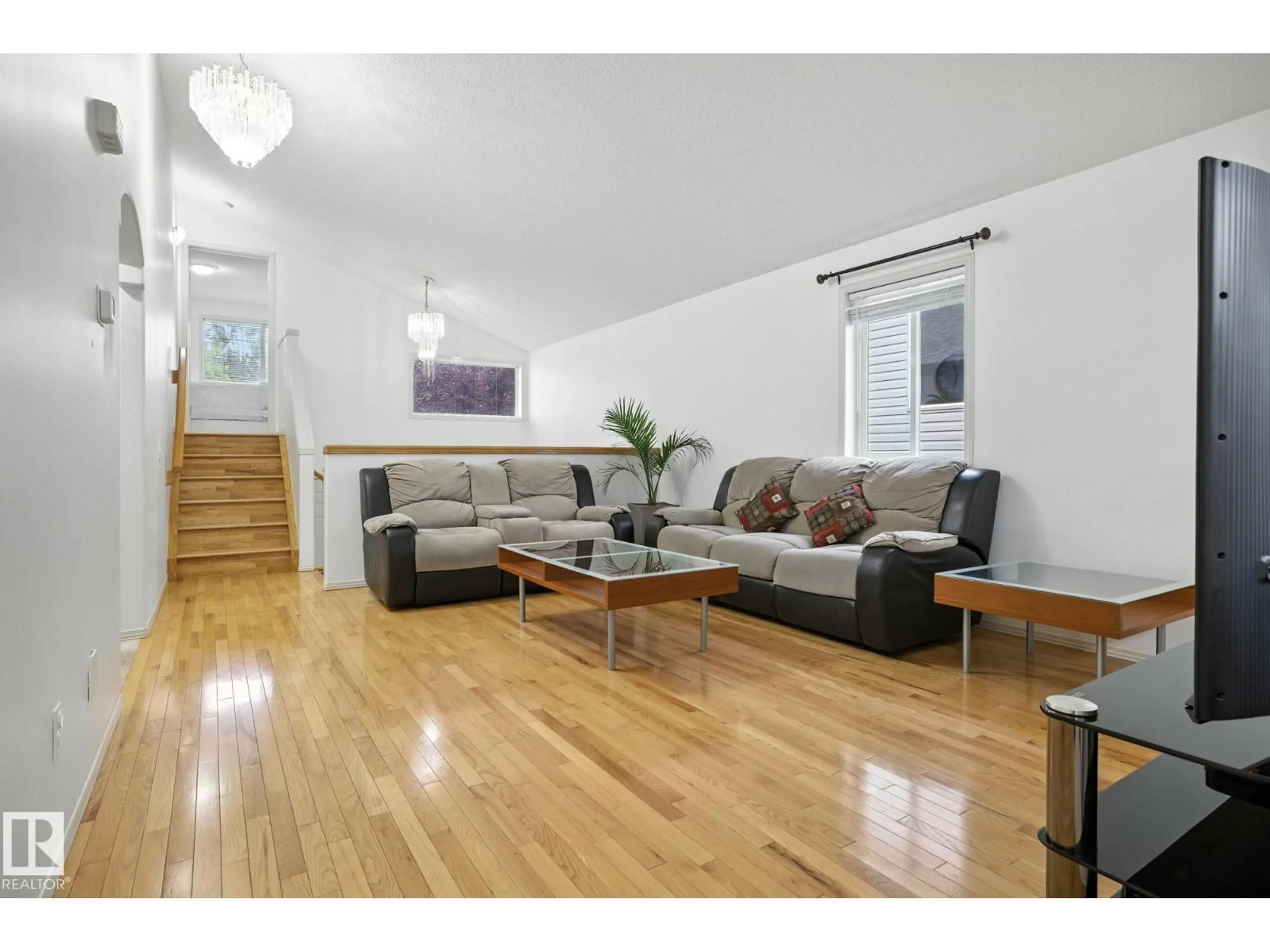 Living room with furniture, wood/laminate floor for 30 ELDORADO DR, St. Albert Alberta T8N7G4