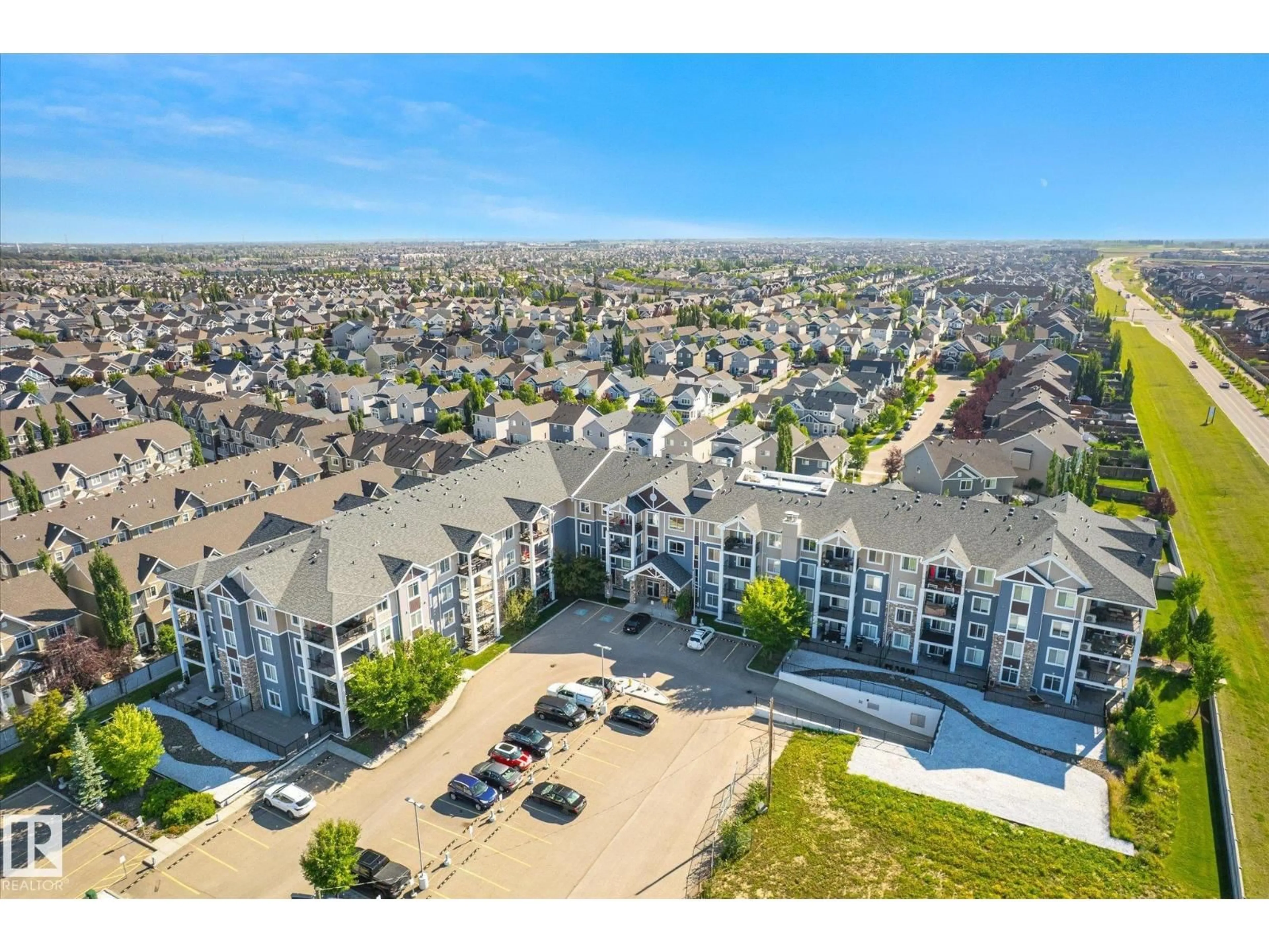A pic from outside/outdoor area/front of a property/back of a property/a pic from drone, mountain view for #316 - 4008 SAVARYN DR, Edmonton Alberta T6X2E5