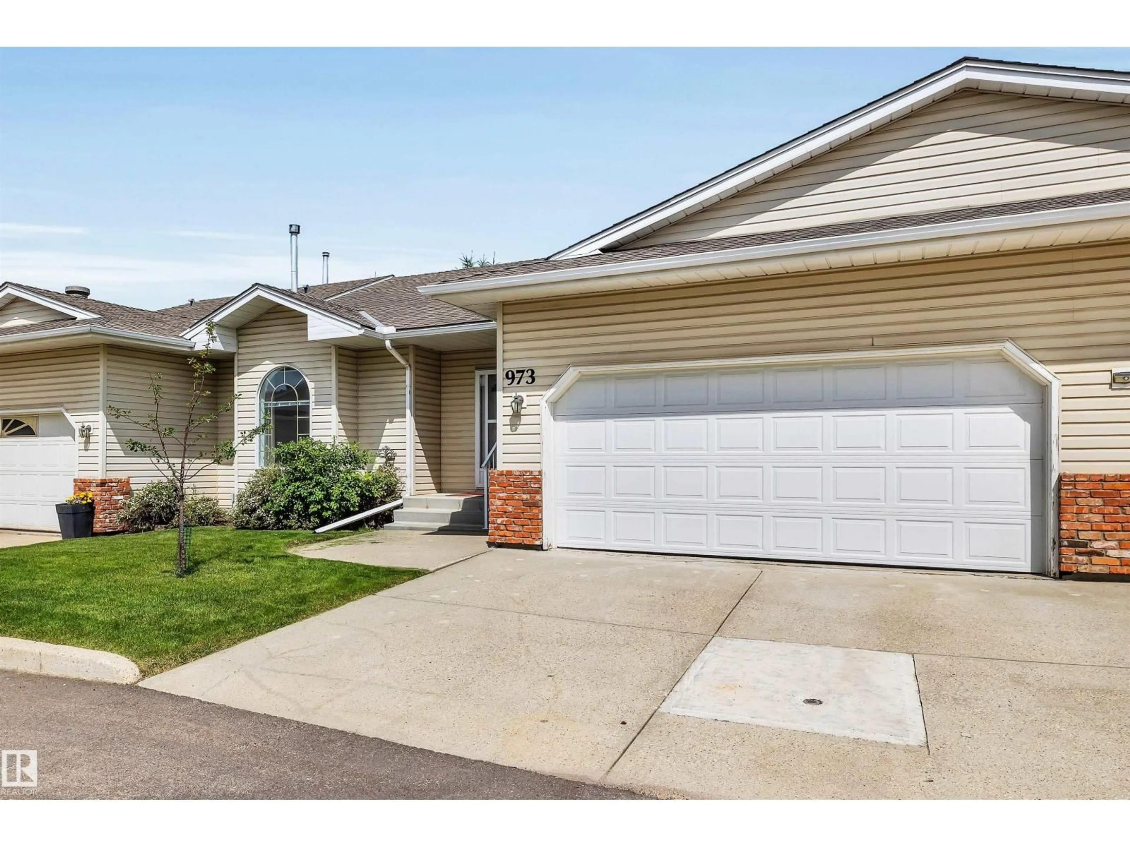 Home with vinyl exterior material, street for 973 YOUVILLE DR, Edmonton Alberta T6L6T2