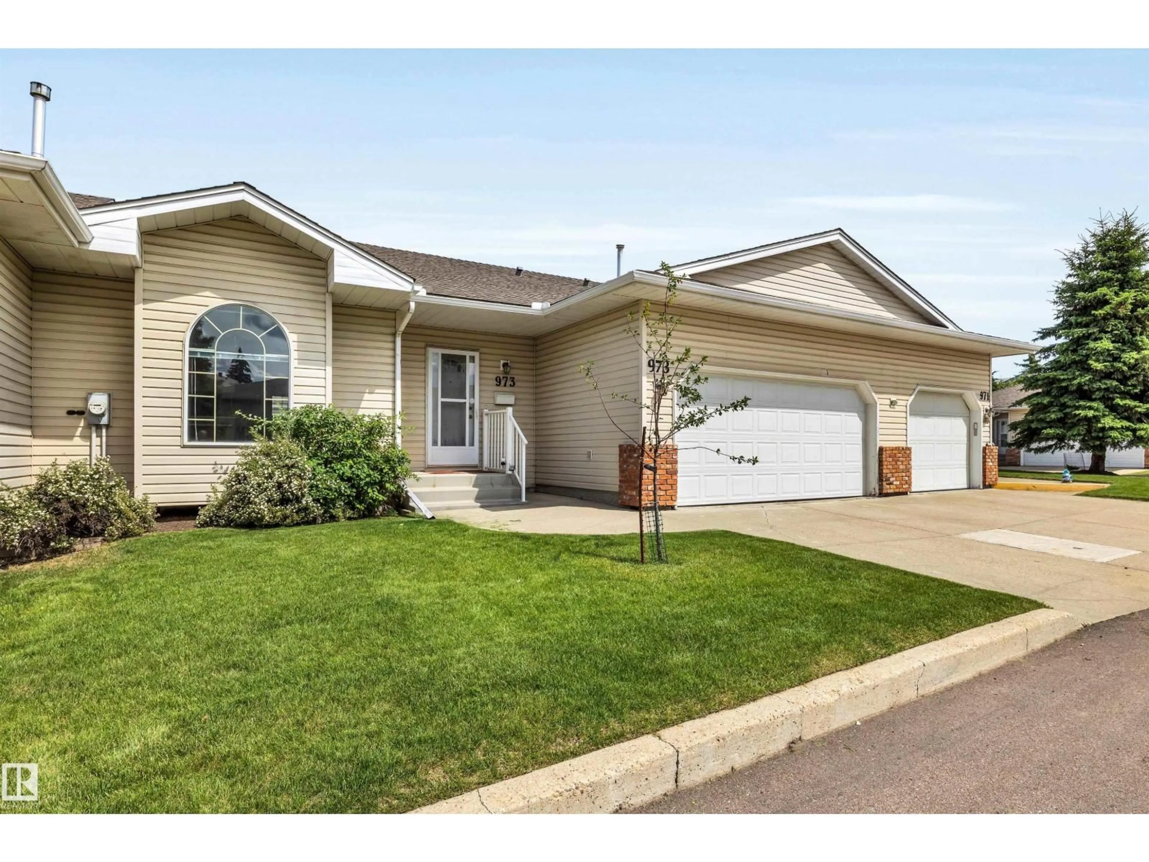 Home with vinyl exterior material, street for 973 YOUVILLE DR, Edmonton Alberta T6L6T2