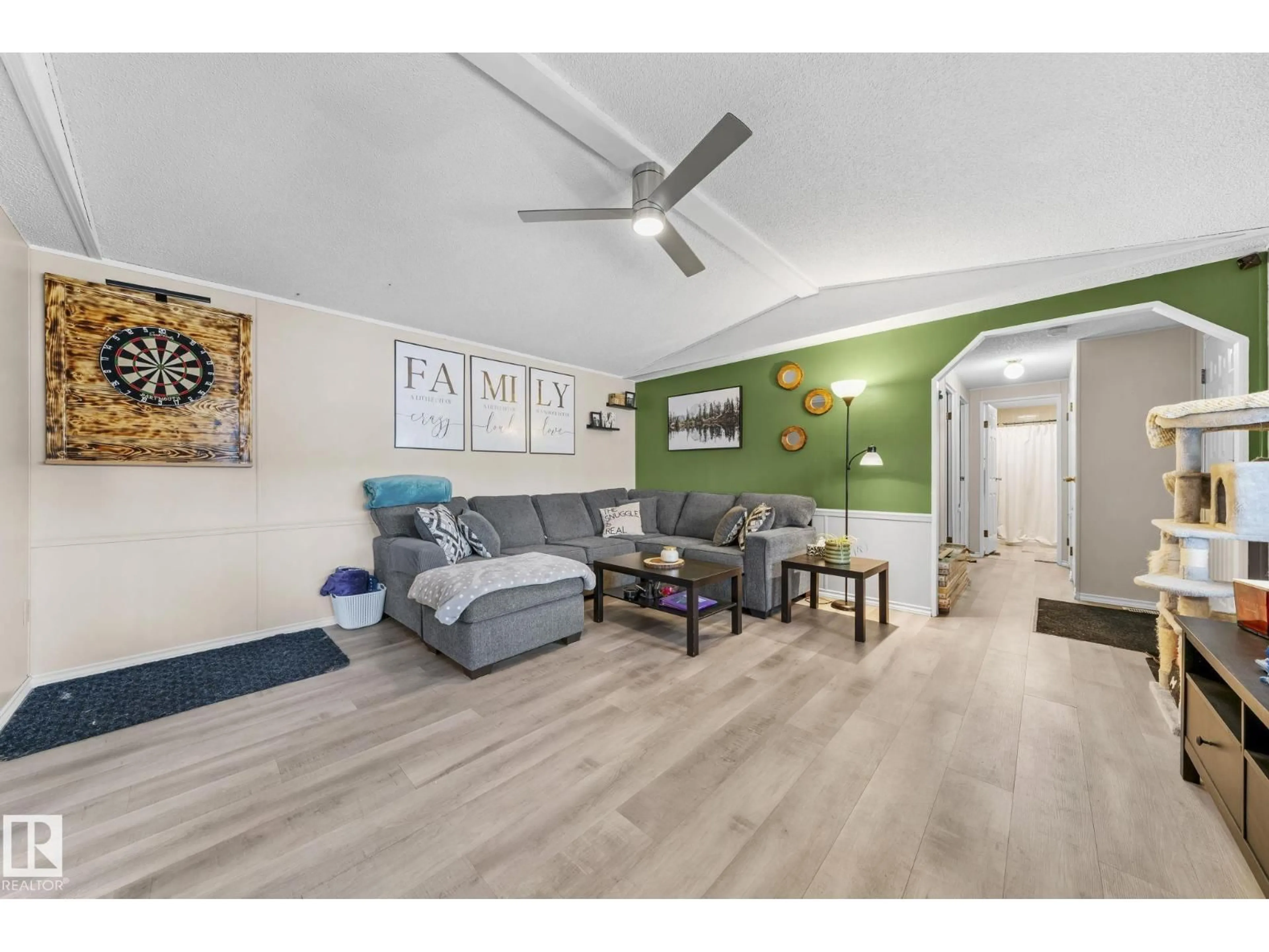 Living room with furniture, wood/laminate floor for 605 EVERGREEN PARK NW, Edmonton Alberta T5Y4M2