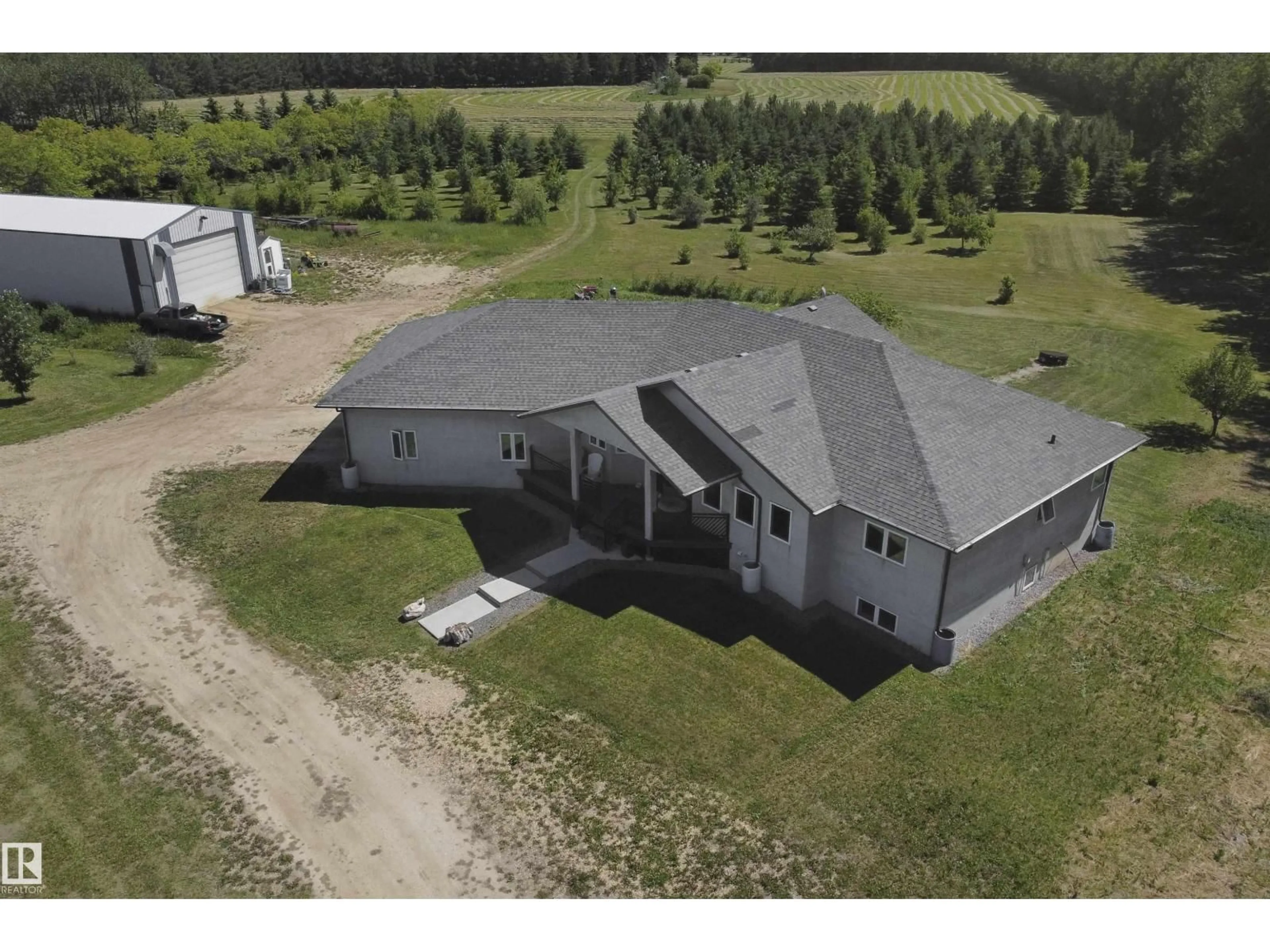 A pic from outside/outdoor area/front of a property/back of a property/a pic from drone, building for 59529A RGE RD 33, Rural Barrhead County Alberta T7N1N2