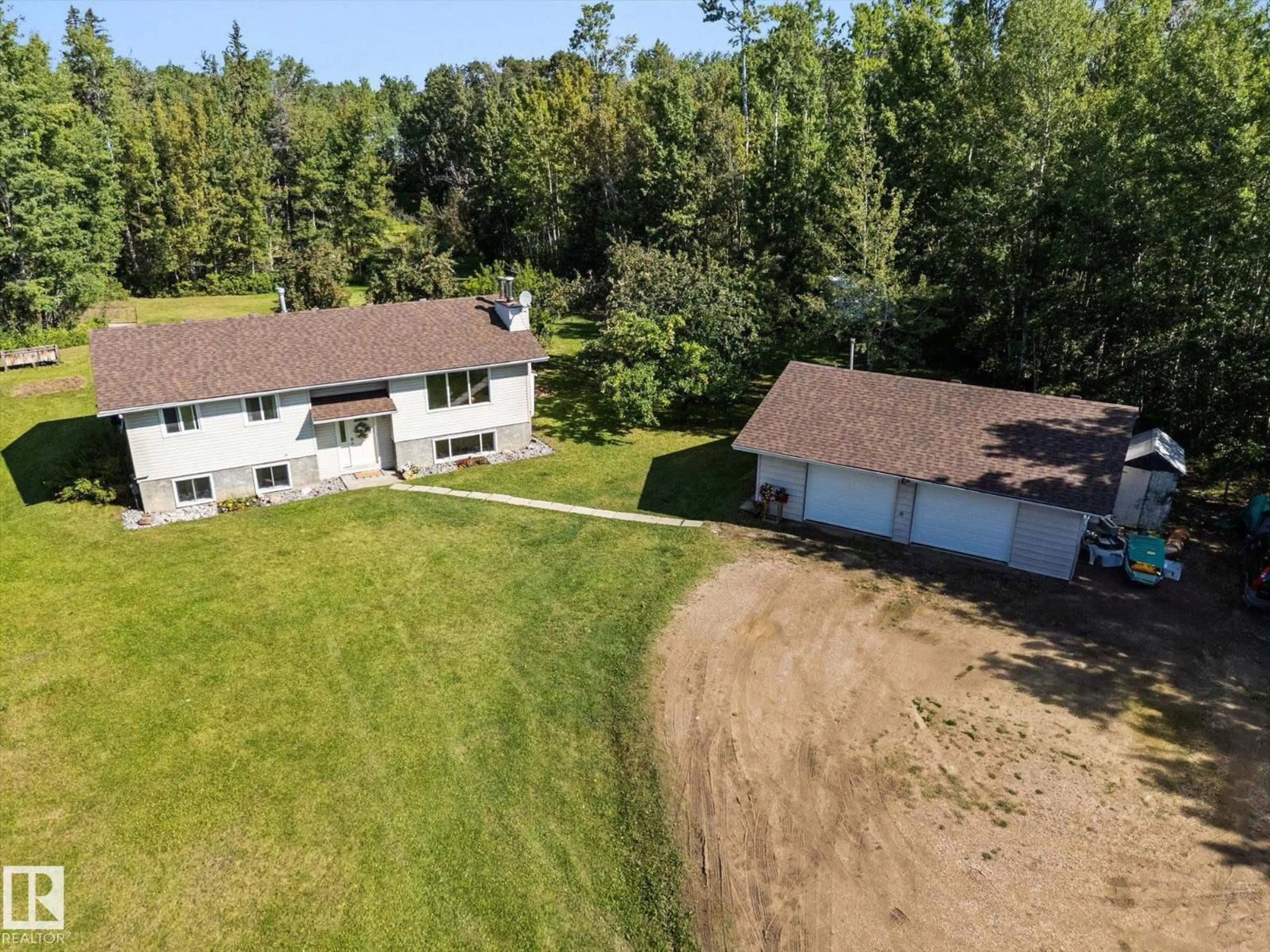 A pic from outside/outdoor area/front of a property/back of a property/a pic from drone, unknown for 11A - 53301 RGE ROAD 32, Rural Parkland County Alberta T0E0N0