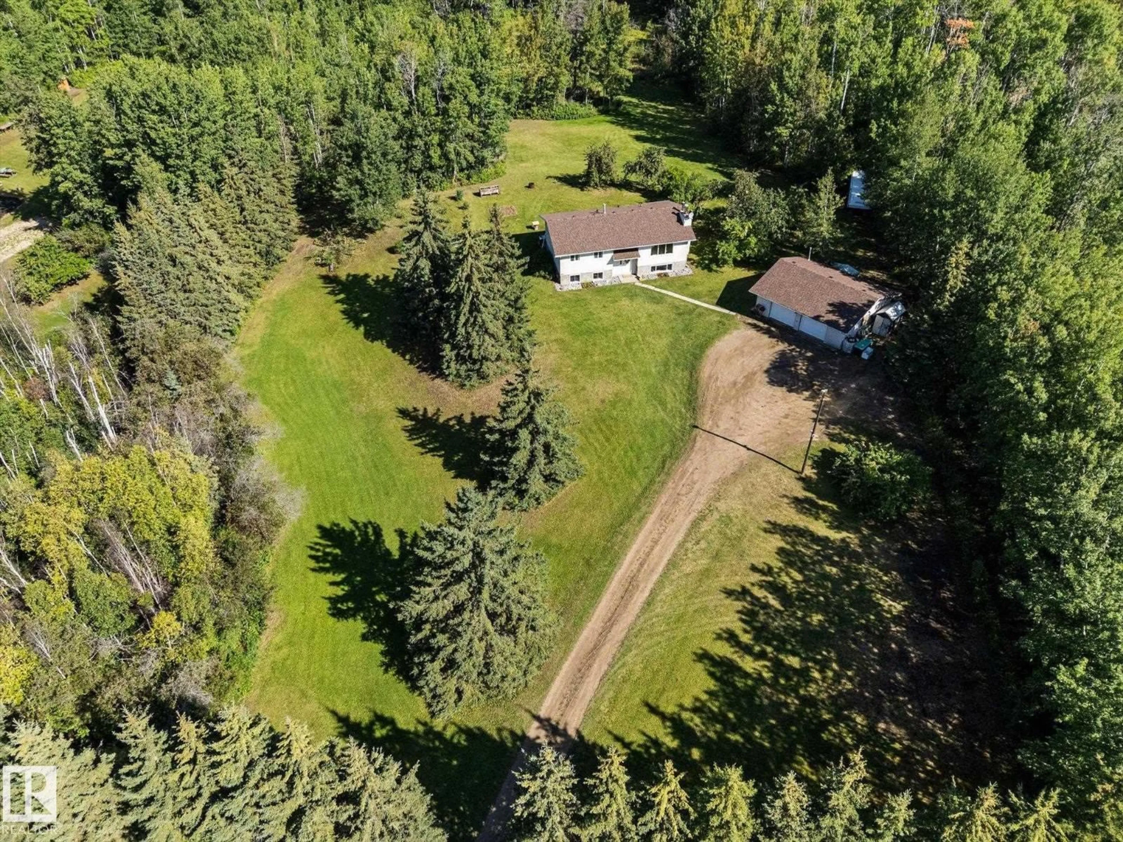 A pic from outside/outdoor area/front of a property/back of a property/a pic from drone, forest/trees view for 11A - 53301 RGE ROAD 32, Rural Parkland County Alberta T0E0N0