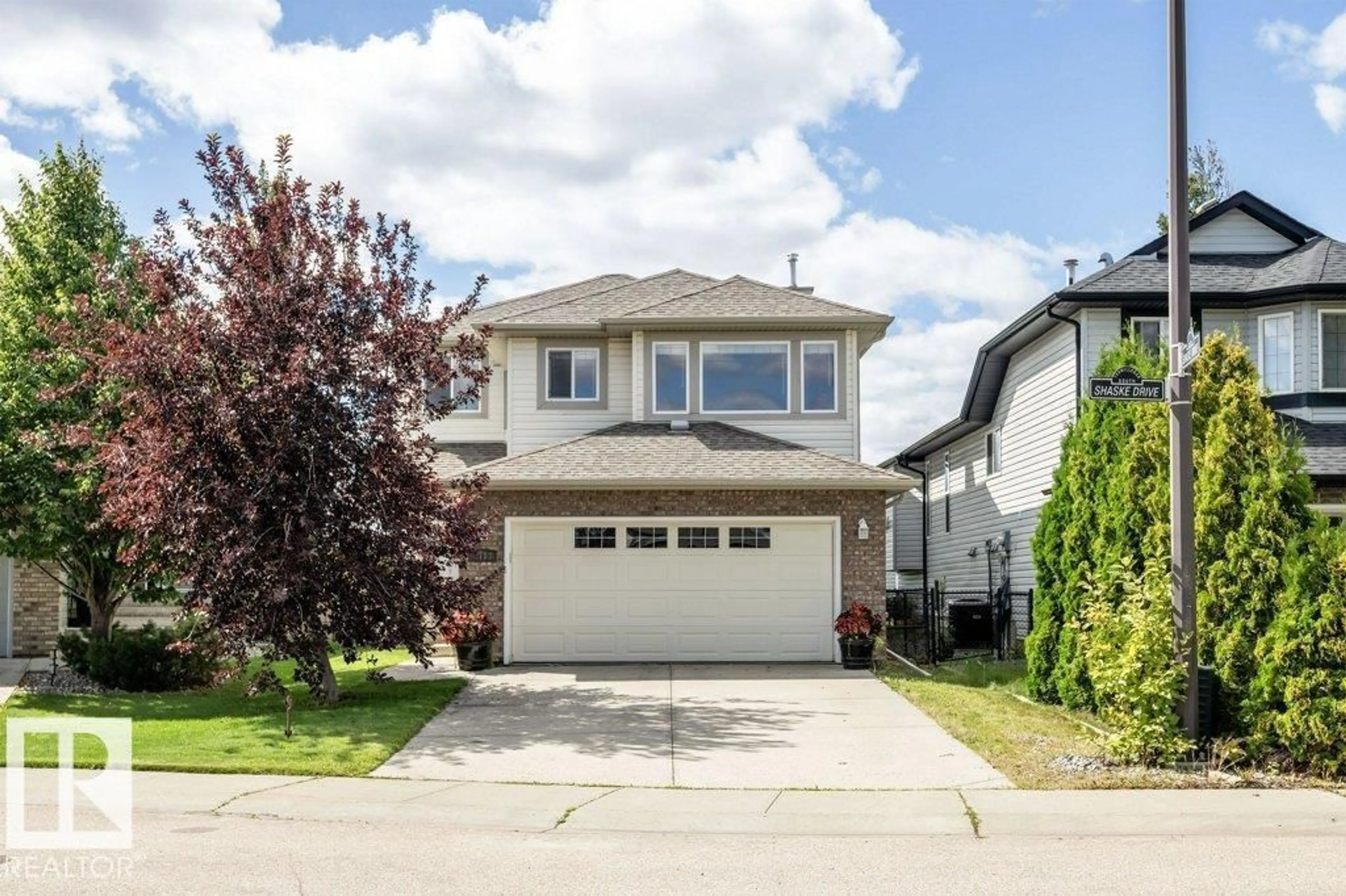 Home with vinyl exterior material, street for 8113 SHASKE DR, Edmonton Alberta T6R0B6