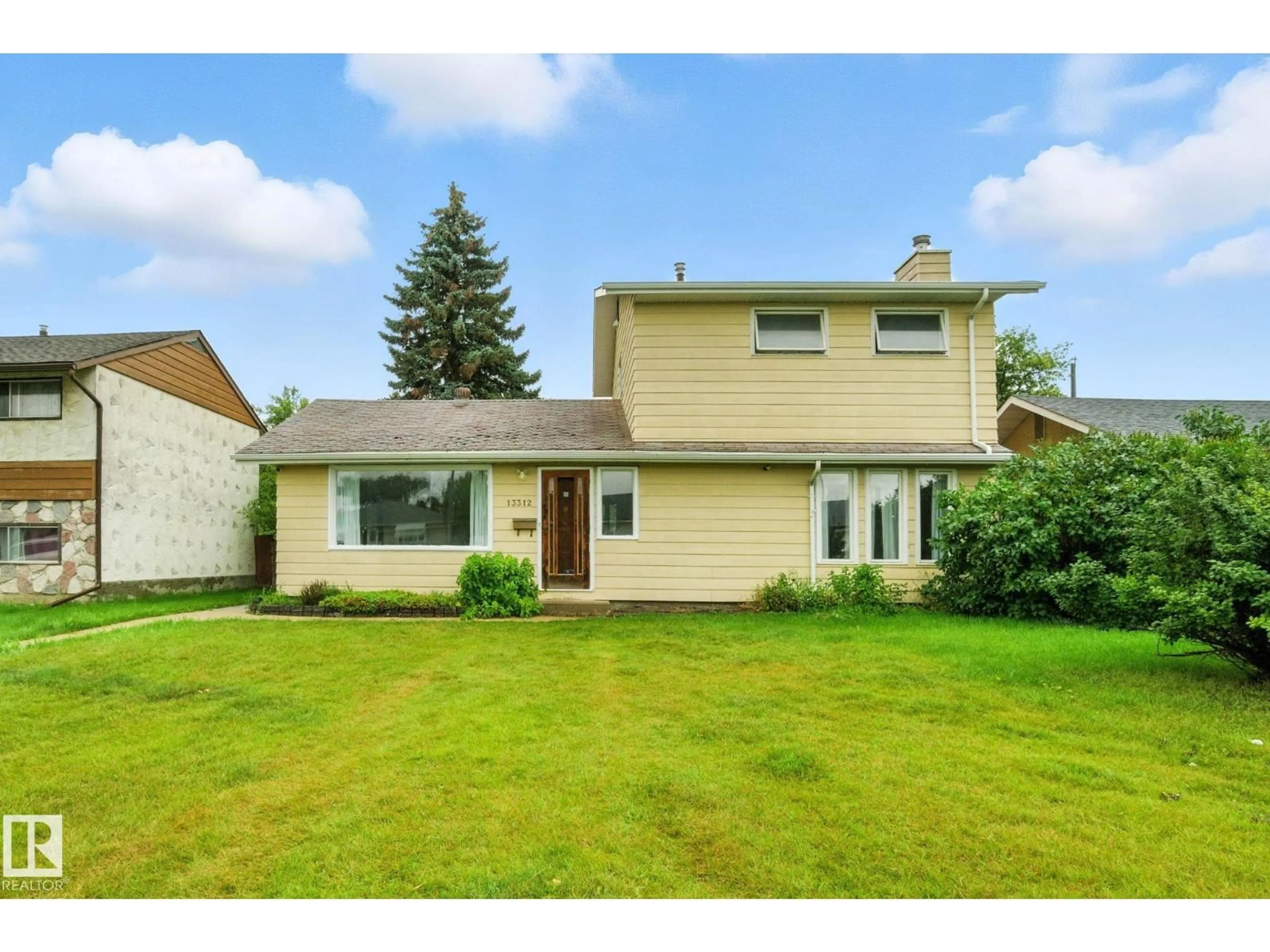 Home with vinyl exterior material, street for NW - 13312 135 ST, Edmonton Alberta T5L1Y7