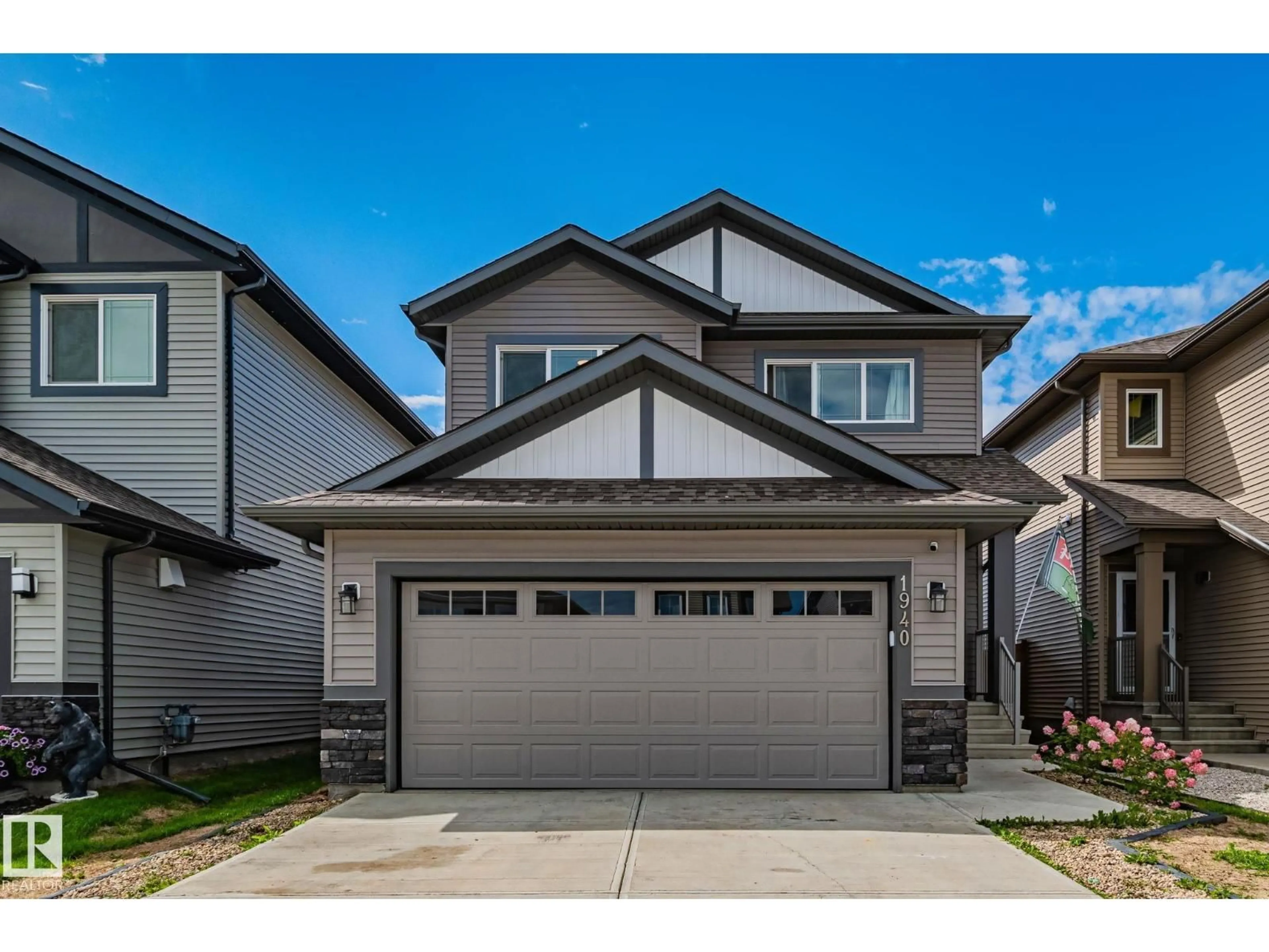 Home with vinyl exterior material, street for 1940 WESTERRA LN, Stony Plain Alberta T7Z0M9