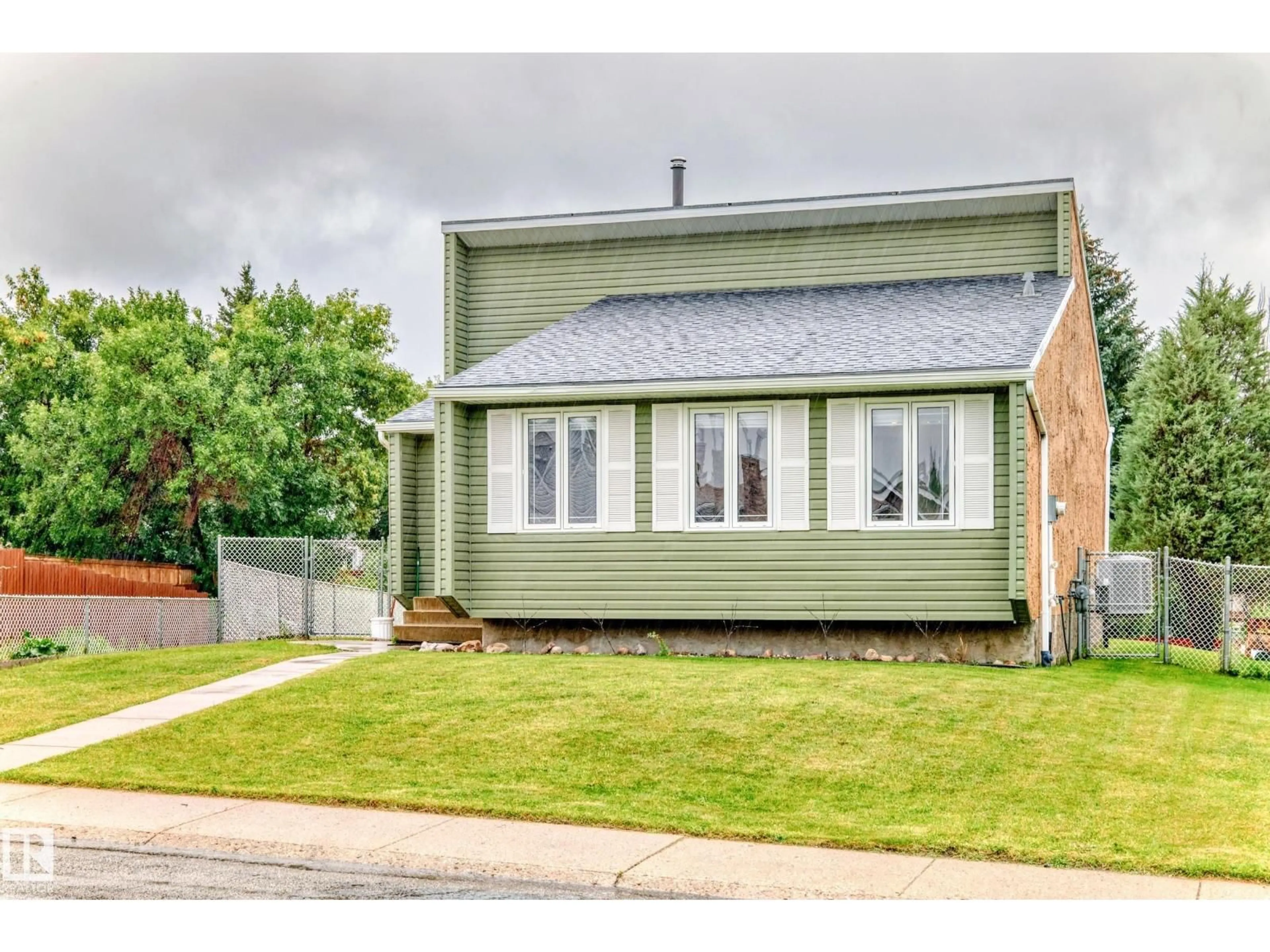 Home with vinyl exterior material, street for NW - 1012 55 ST, Edmonton Alberta T6L1Y7