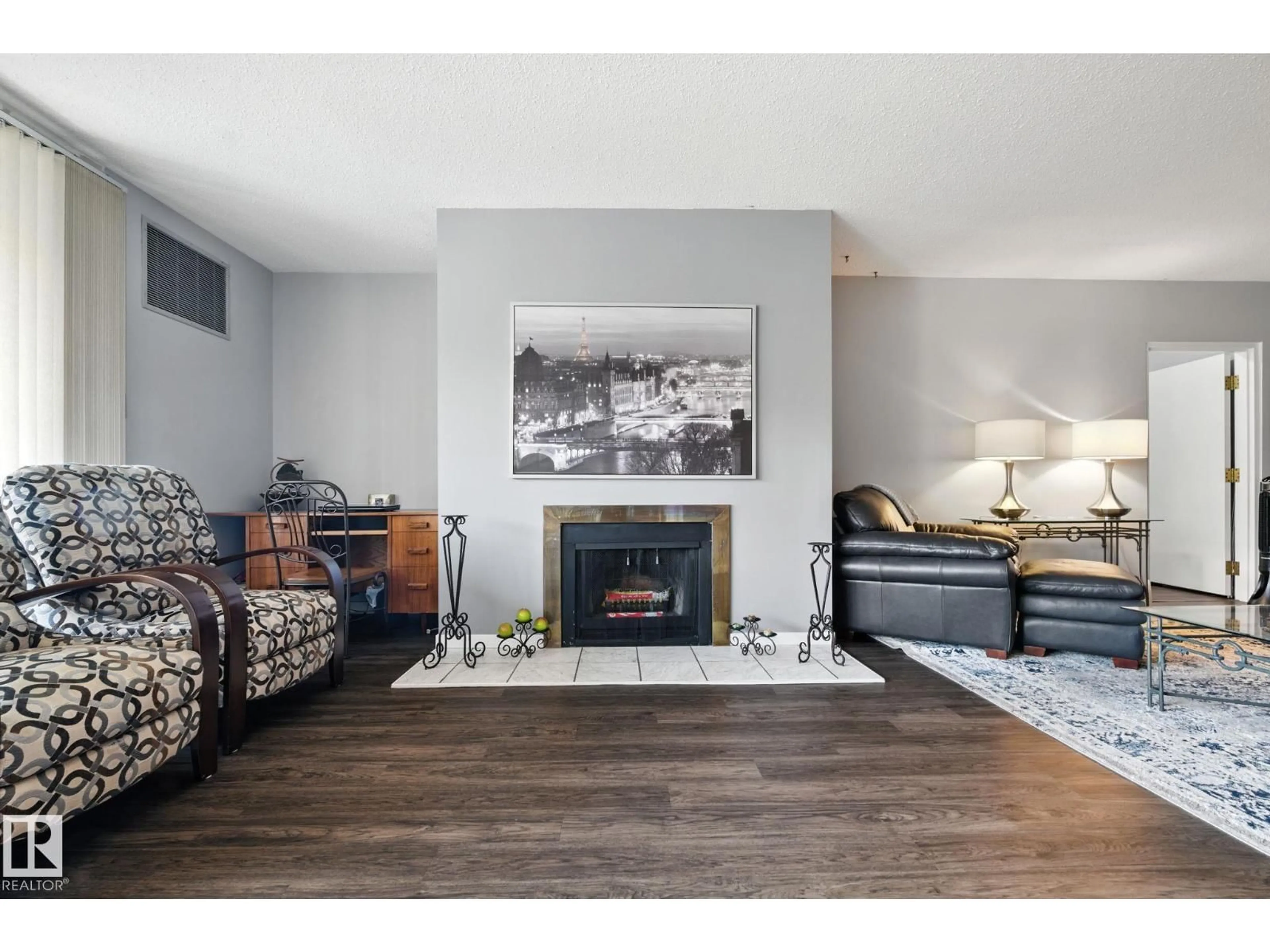 Living room with furniture, wood/laminate floor for 405 - 9809 110 ST, Edmonton Alberta T5K2J9