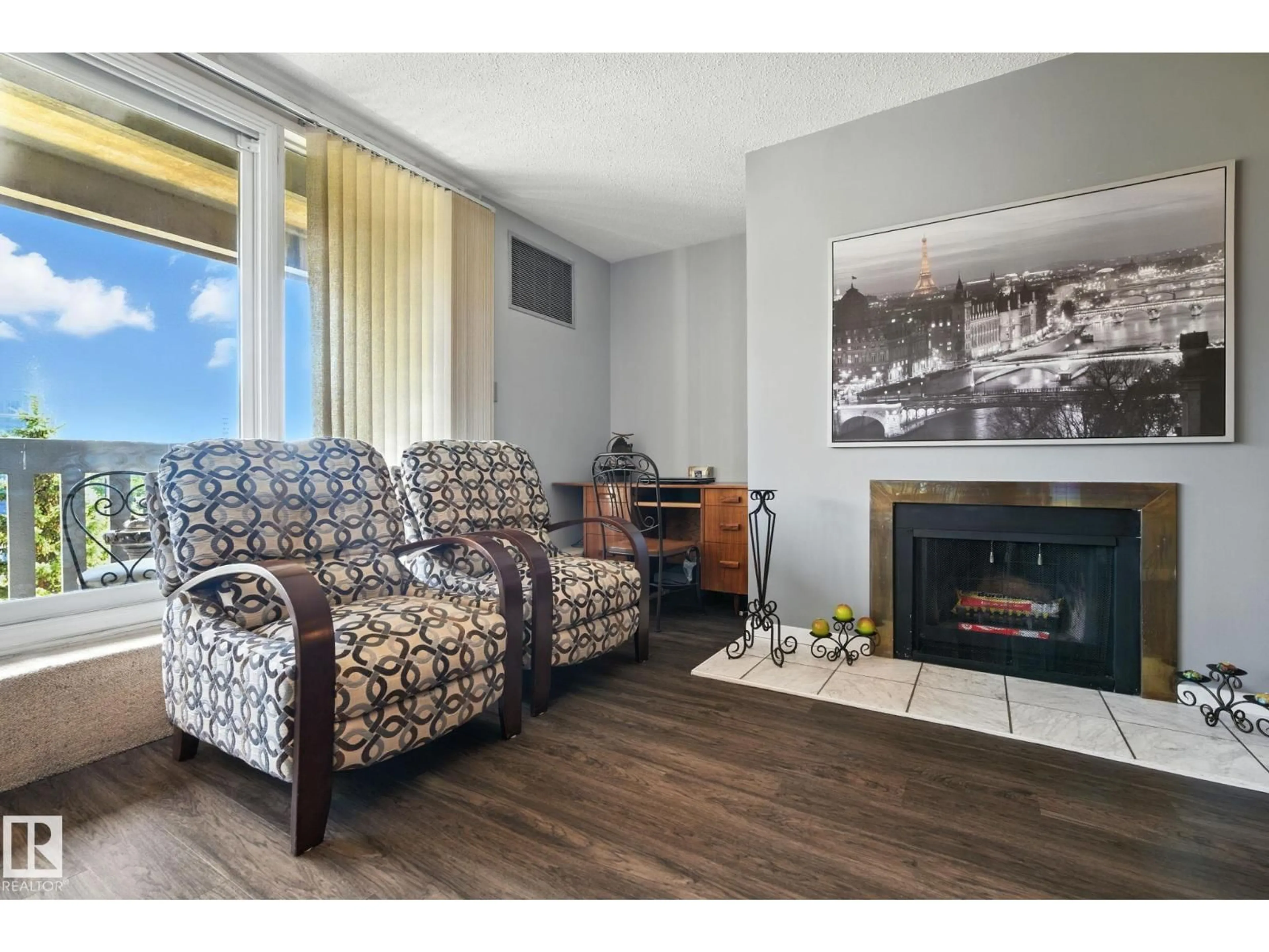 Living room with furniture, wood/laminate floor for 405 - 9809 110 ST, Edmonton Alberta T5K2J9
