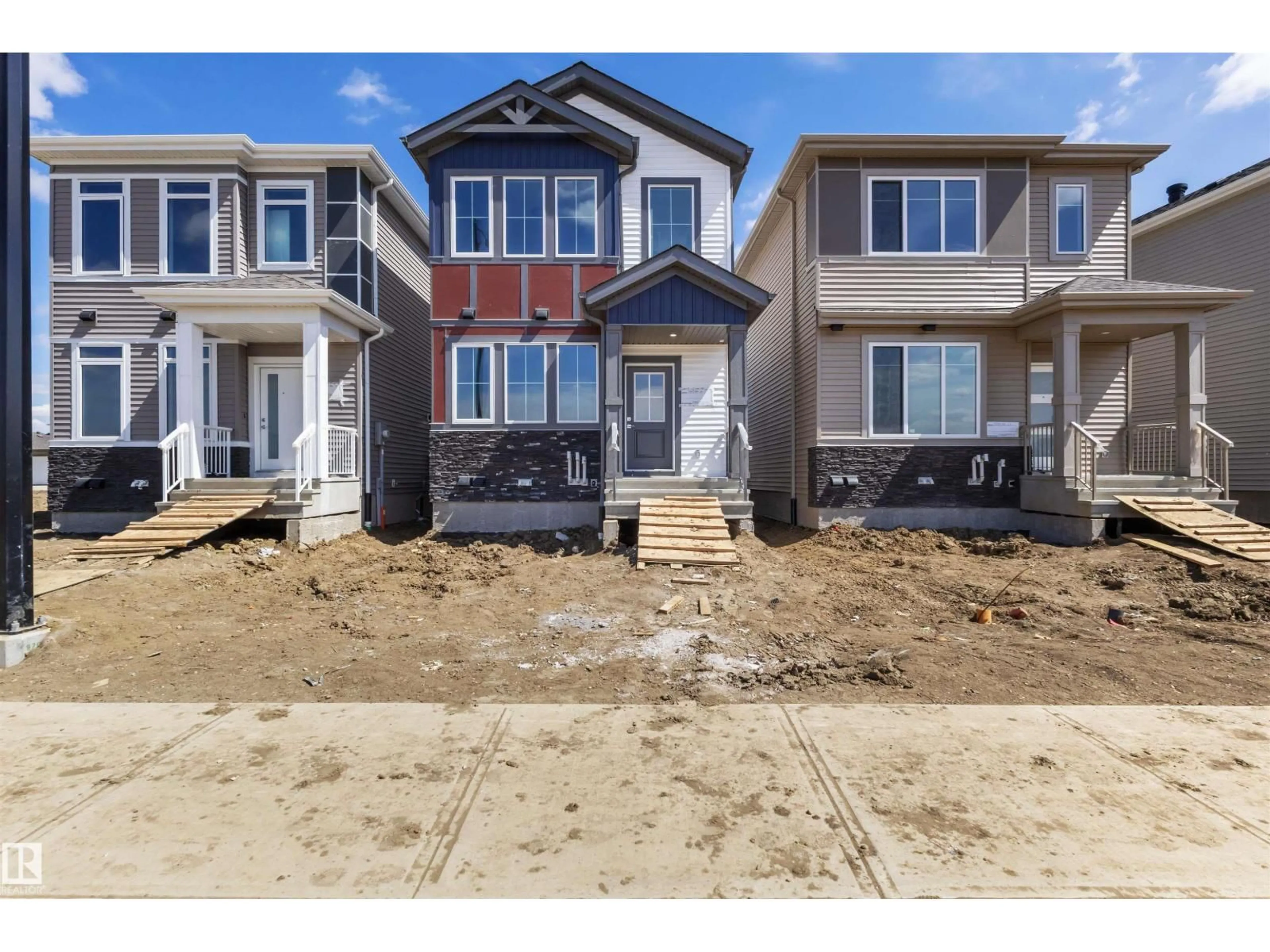Home with vinyl exterior material, street for NW - 1943 210 ST, Edmonton Alberta T6M3H5