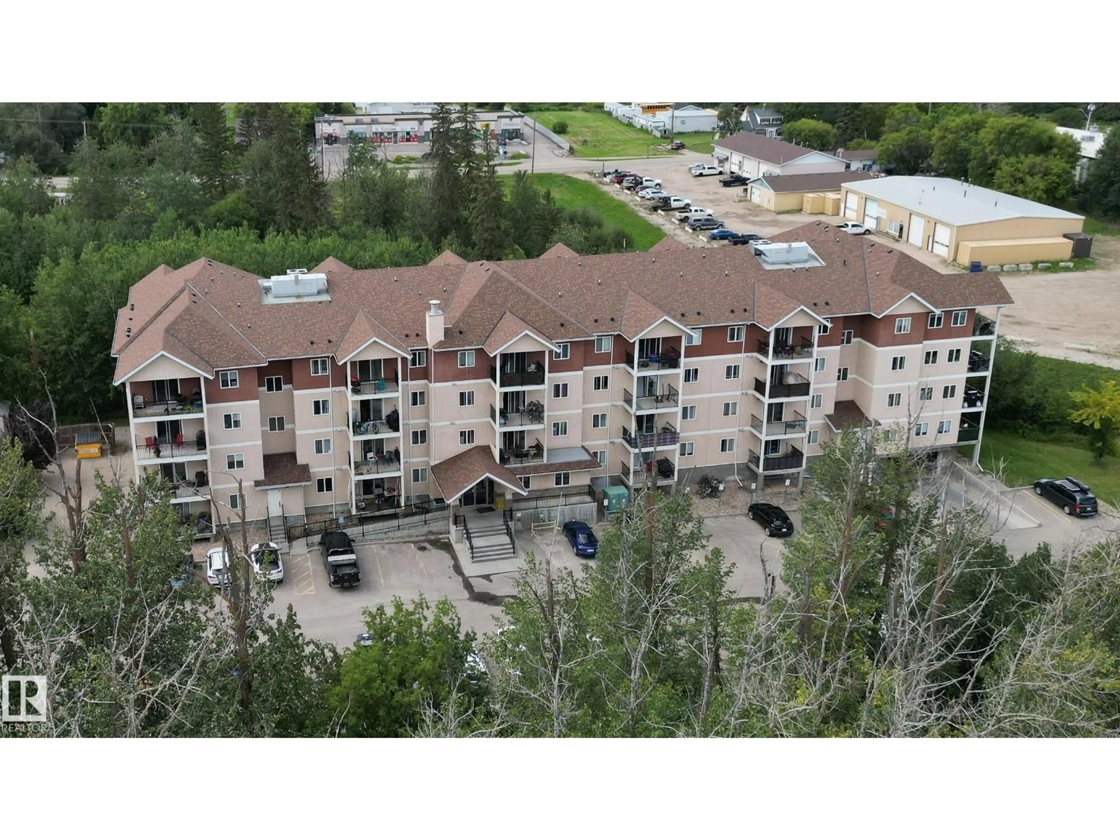 A pic from outside/outdoor area/front of a property/back of a property/a pic from drone, building for #302 - 4903 47 AV, Stony Plain Alberta T7Z0C6