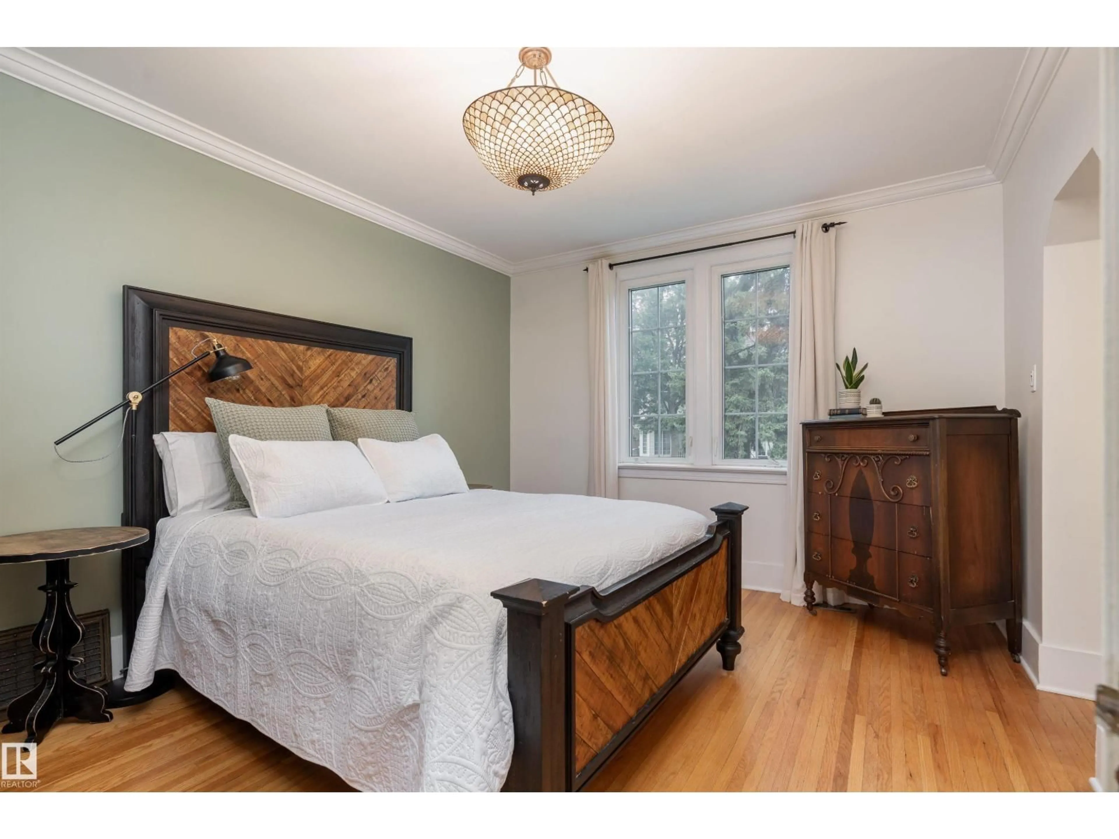 Bedroom with bed, wood/laminate floor for 10015 97 AV, Edmonton Alberta T5K0A9