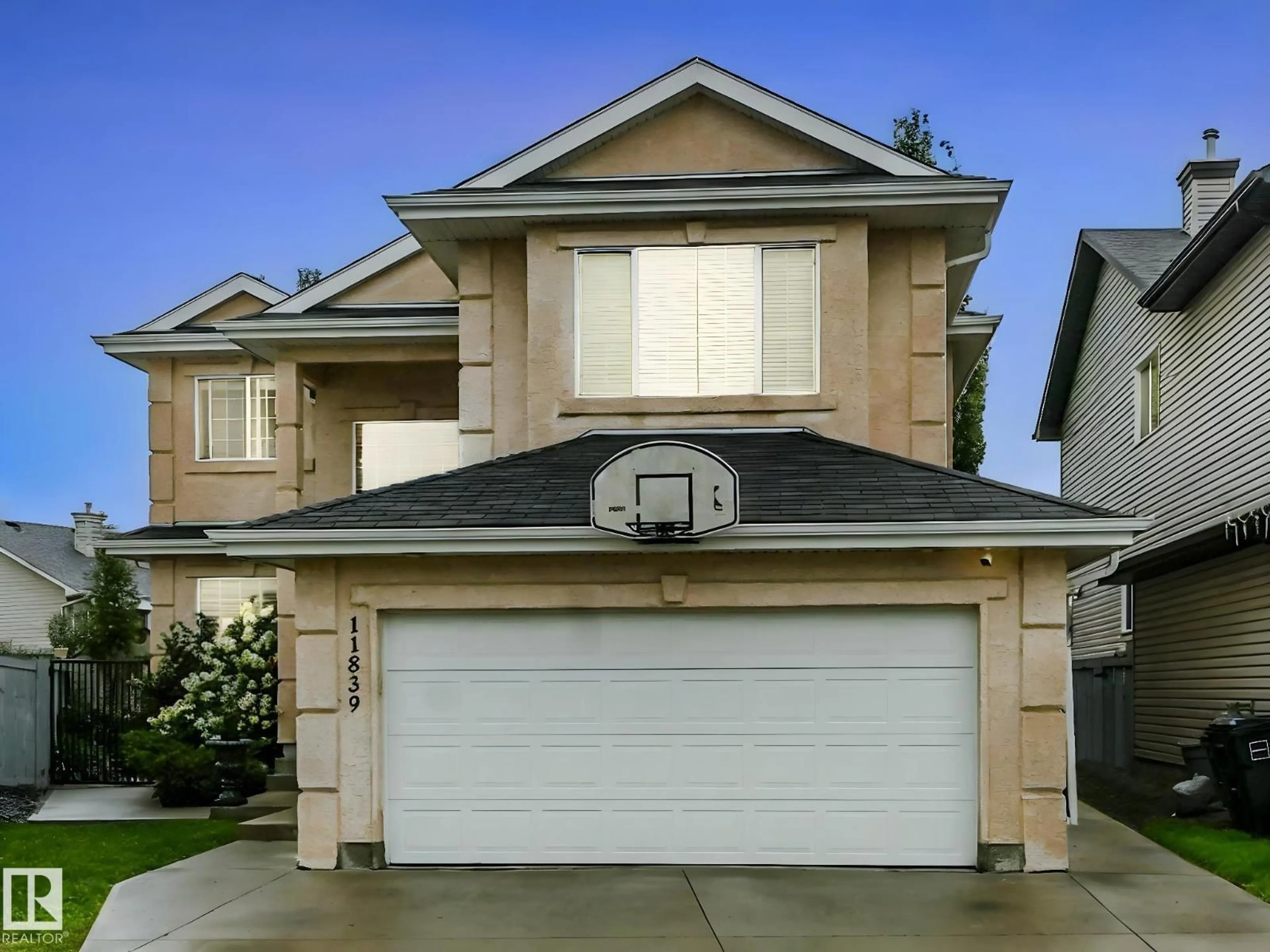 Home with vinyl exterior material, street for 11839 174 AV, Edmonton Alberta T5X0A6