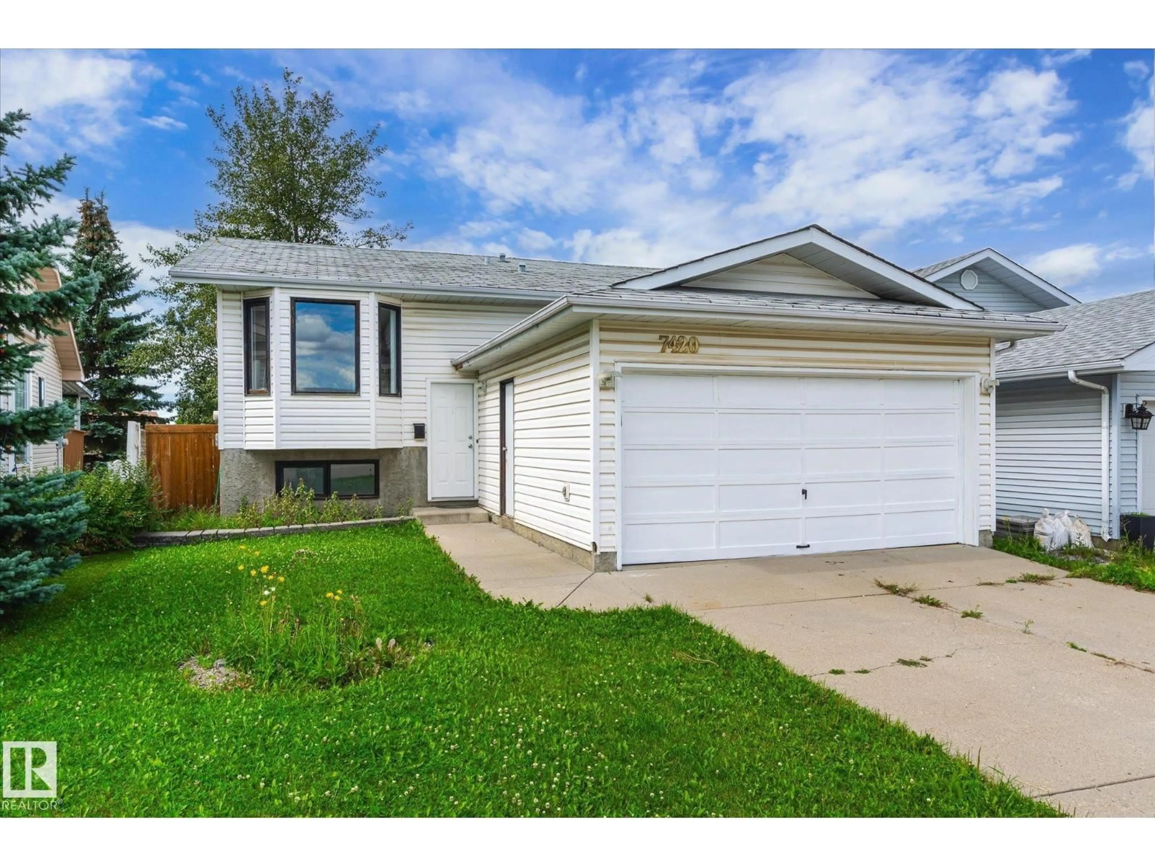 Home with vinyl exterior material, street for 7420 187 ST, Edmonton Alberta T5T5W4