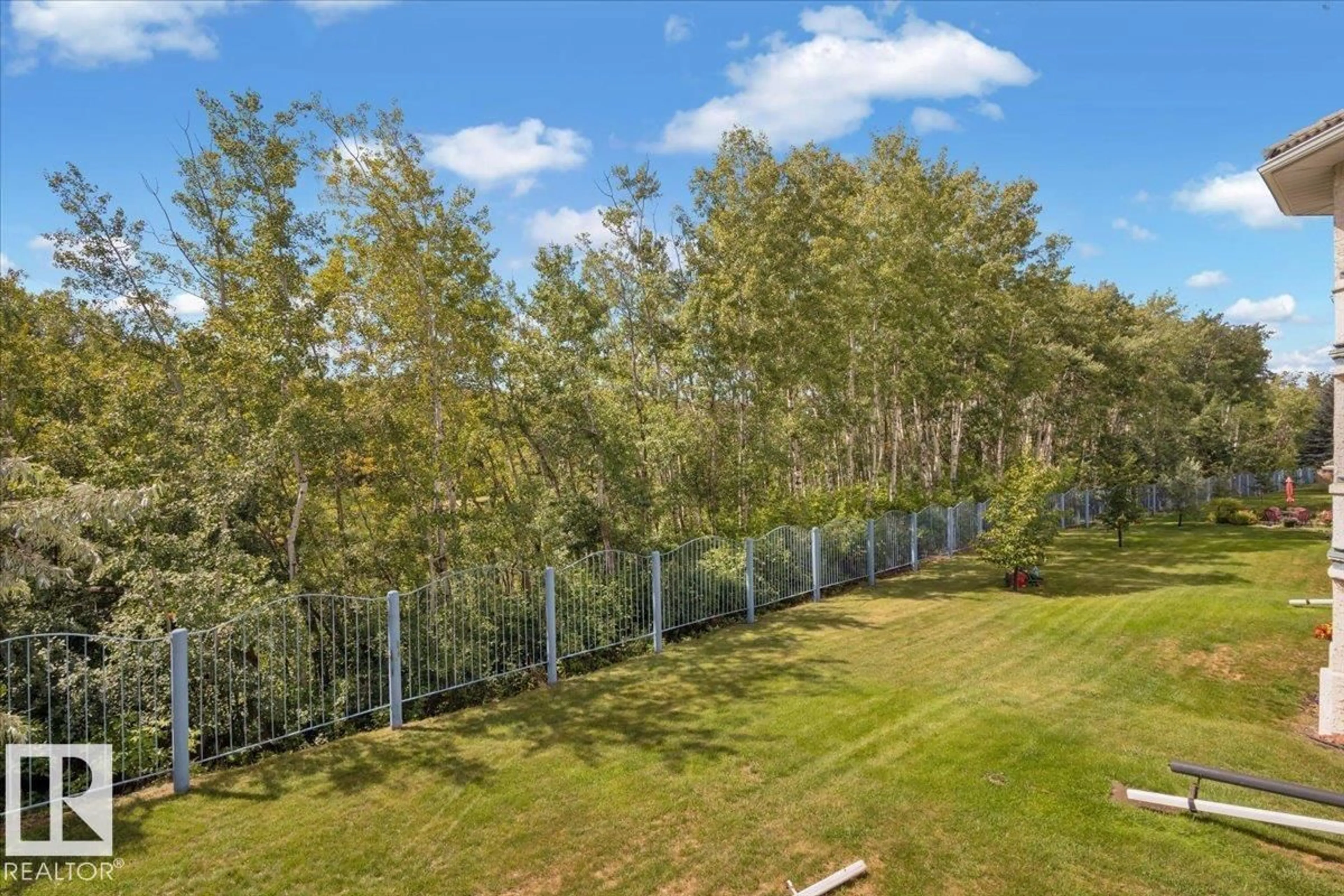A pic from outside/outdoor area/front of a property/back of a property/a pic from drone, forest/trees view for #215 - 215 GERVAIS RD, St. Albert Alberta T8N6H7