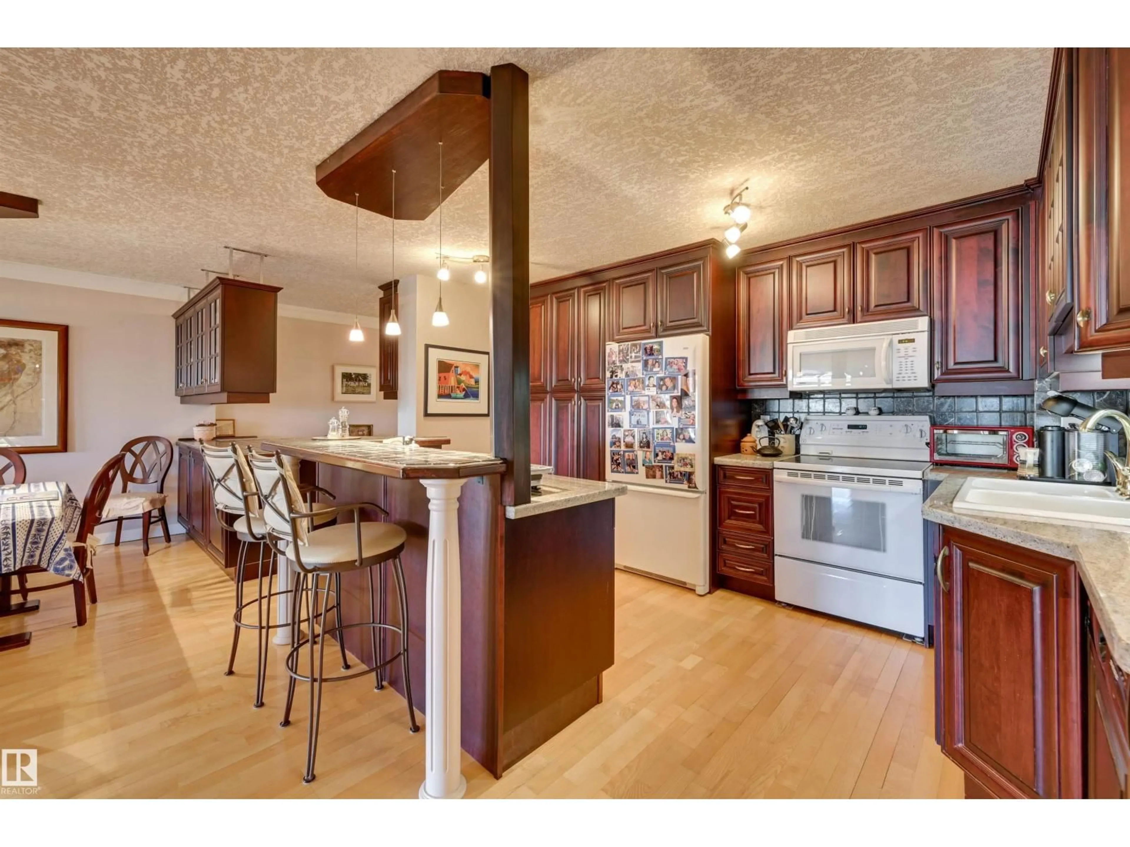 Open concept kitchen, wood/laminate floor for 1102 - 11503 100 AV, Edmonton Alberta T5K2K7