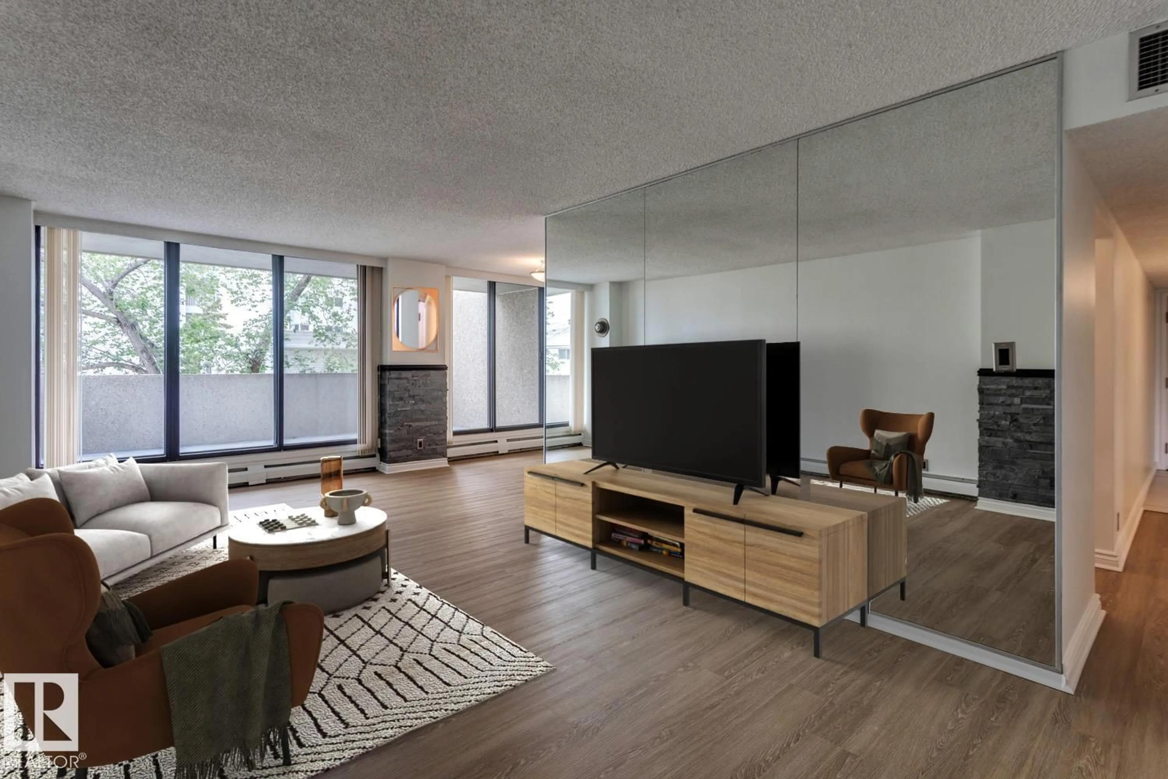 Living room with furniture, wood/laminate floor for 201 - 8340 JASPER AV, Edmonton Alberta T5H4C6