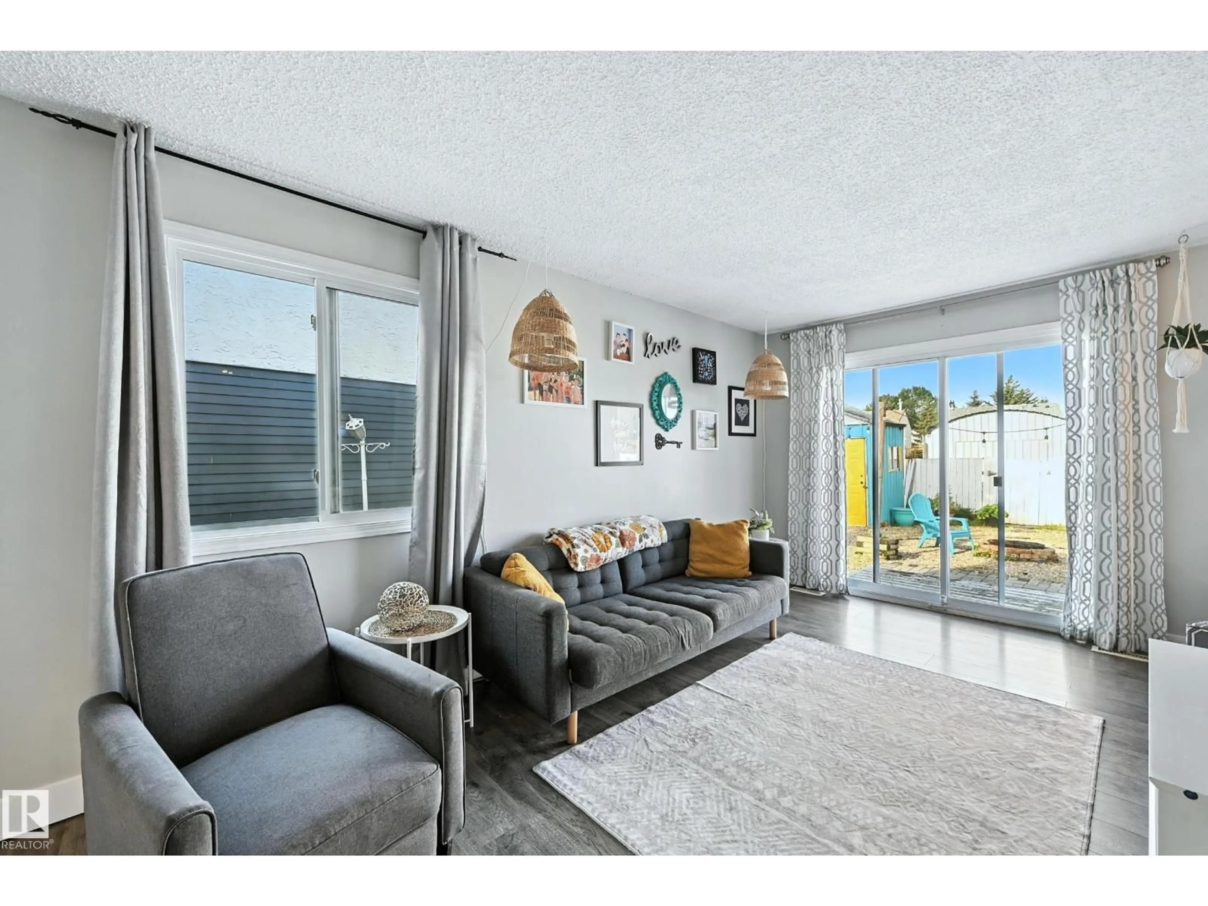 Living room with furniture, unknown for 57 PIPESTONE DR, Devon Alberta T9G1T4