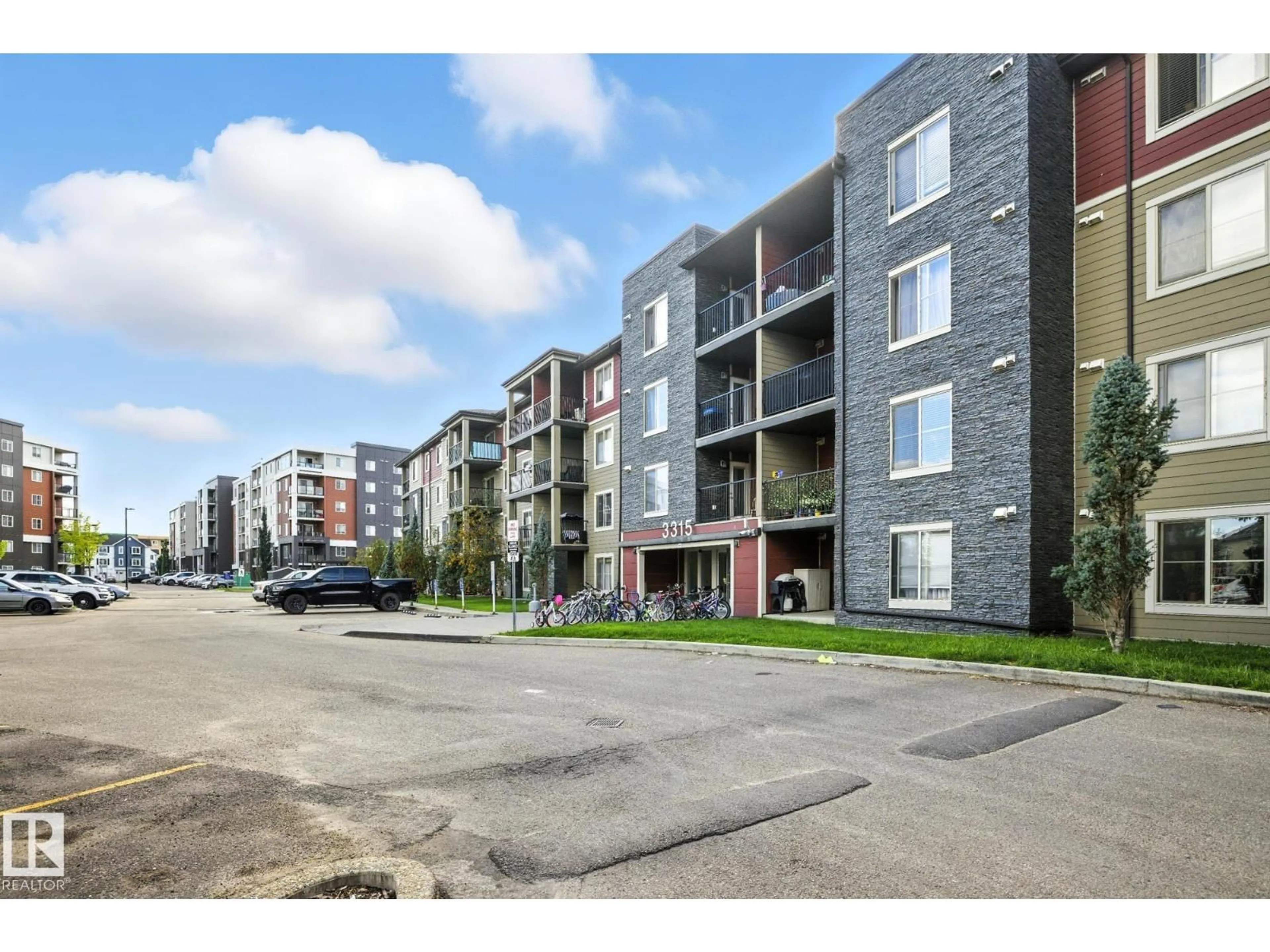 A pic from outside/outdoor area/front of a property/back of a property/a pic from drone, street for #416 - 3315 JAMES MOWATT TR, Edmonton Alberta T6W3L9