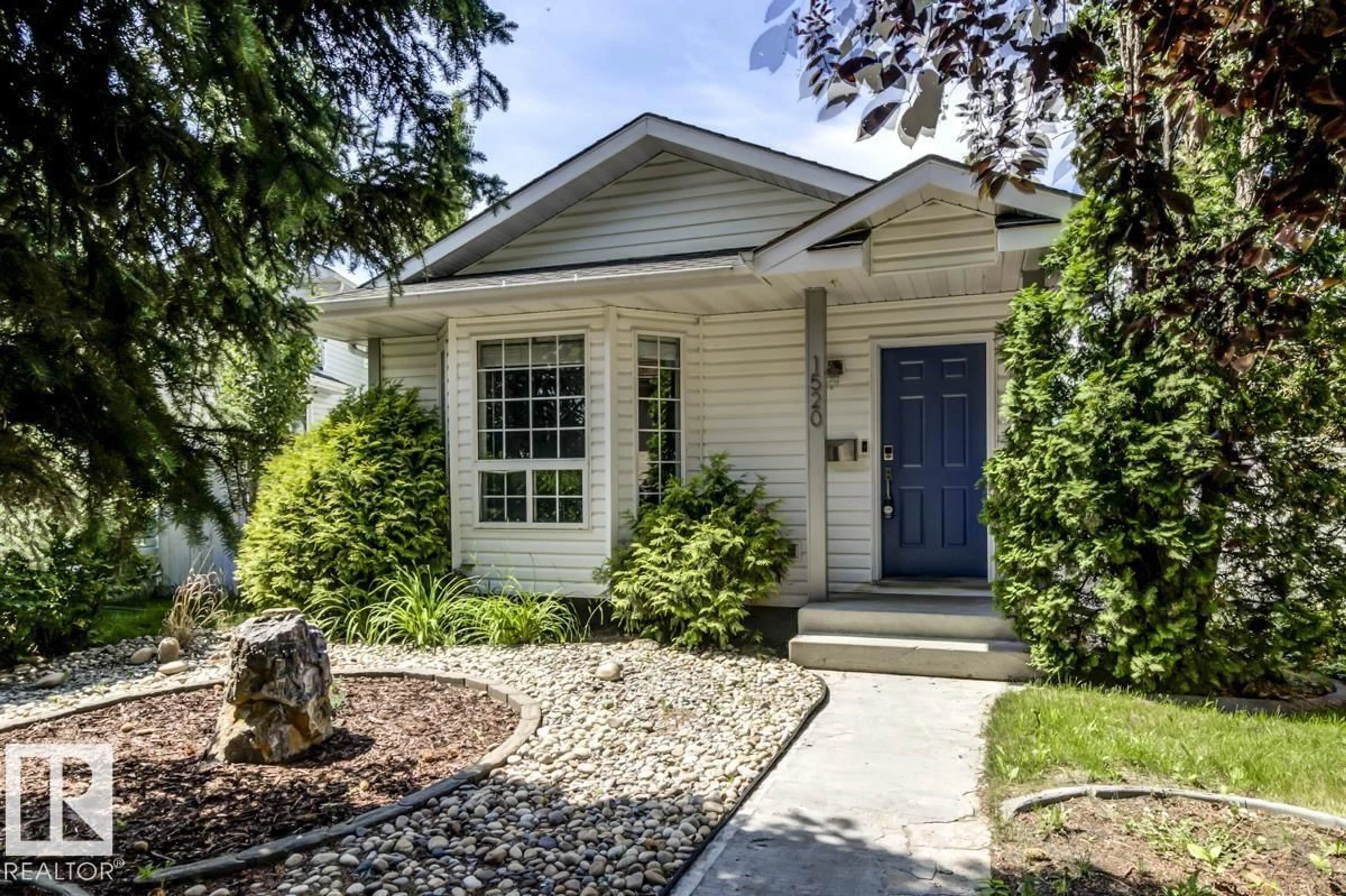 Home with vinyl exterior material, street for 1520 80A ST, Edmonton Alberta T6K4E2