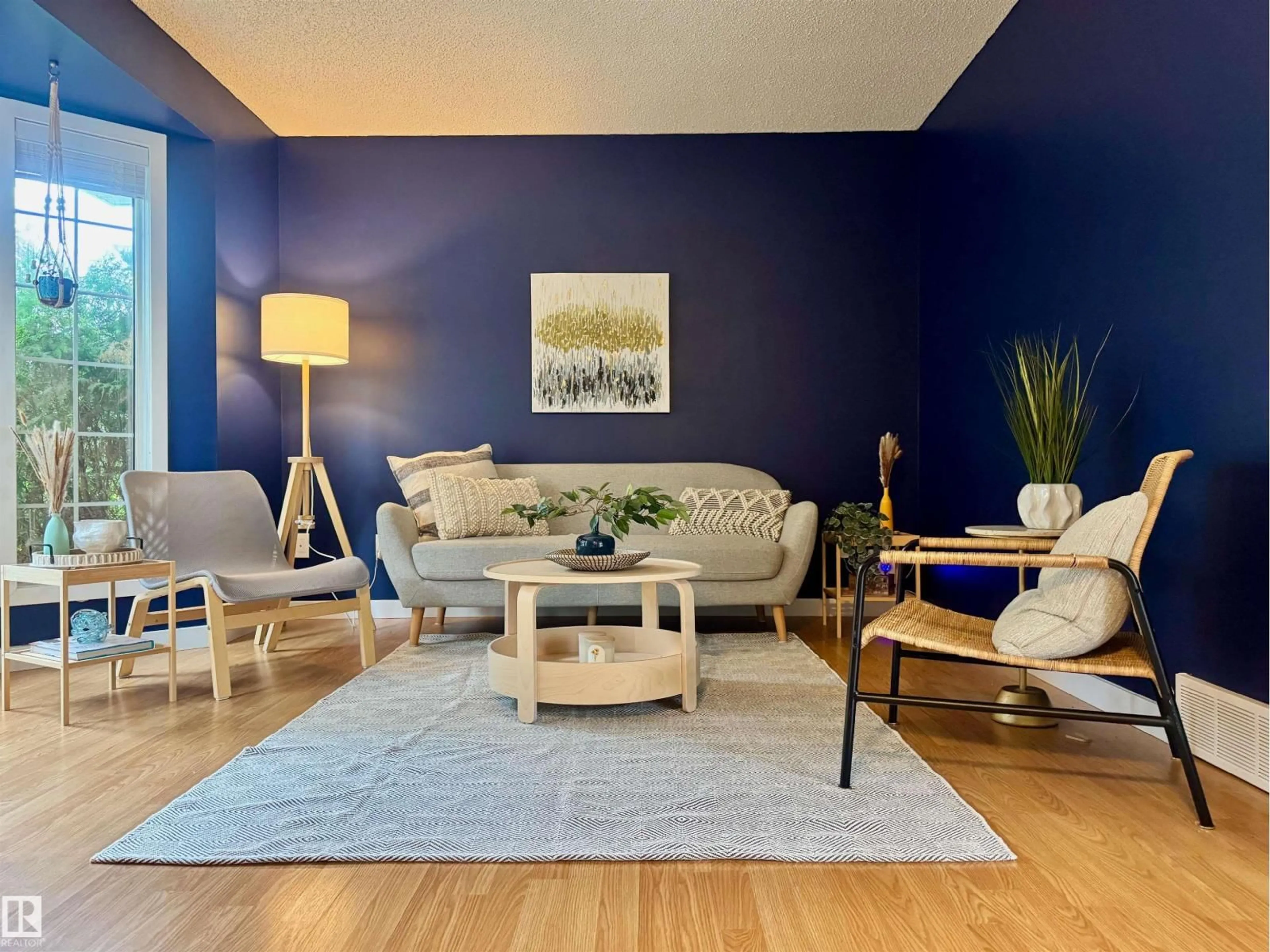 Living room with furniture, wood/laminate floor for 1520 80A ST, Edmonton Alberta T6K4E2