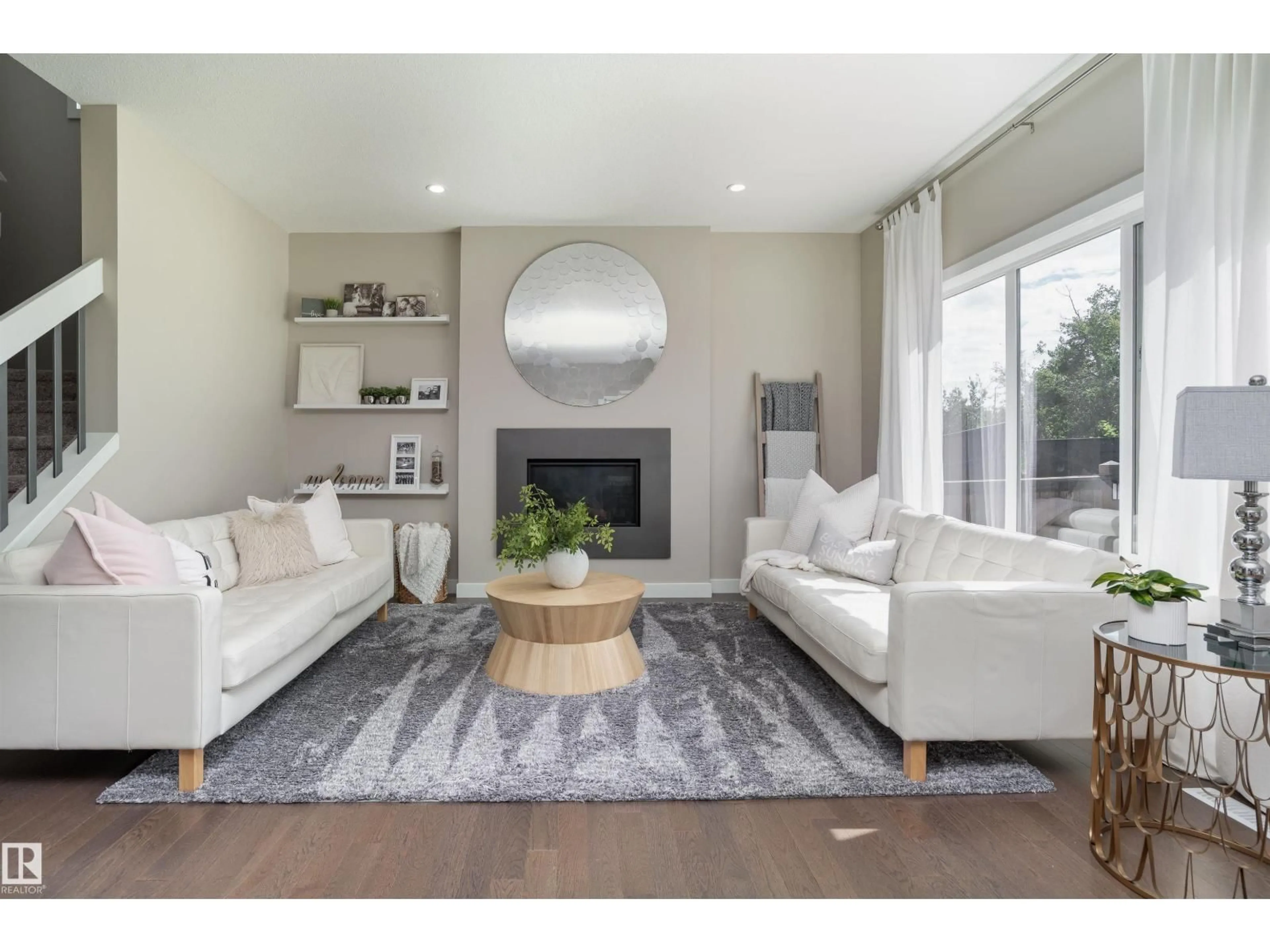 Living room with furniture, wood/laminate floor for 5831 175 AV, Edmonton Alberta T5Y0T4