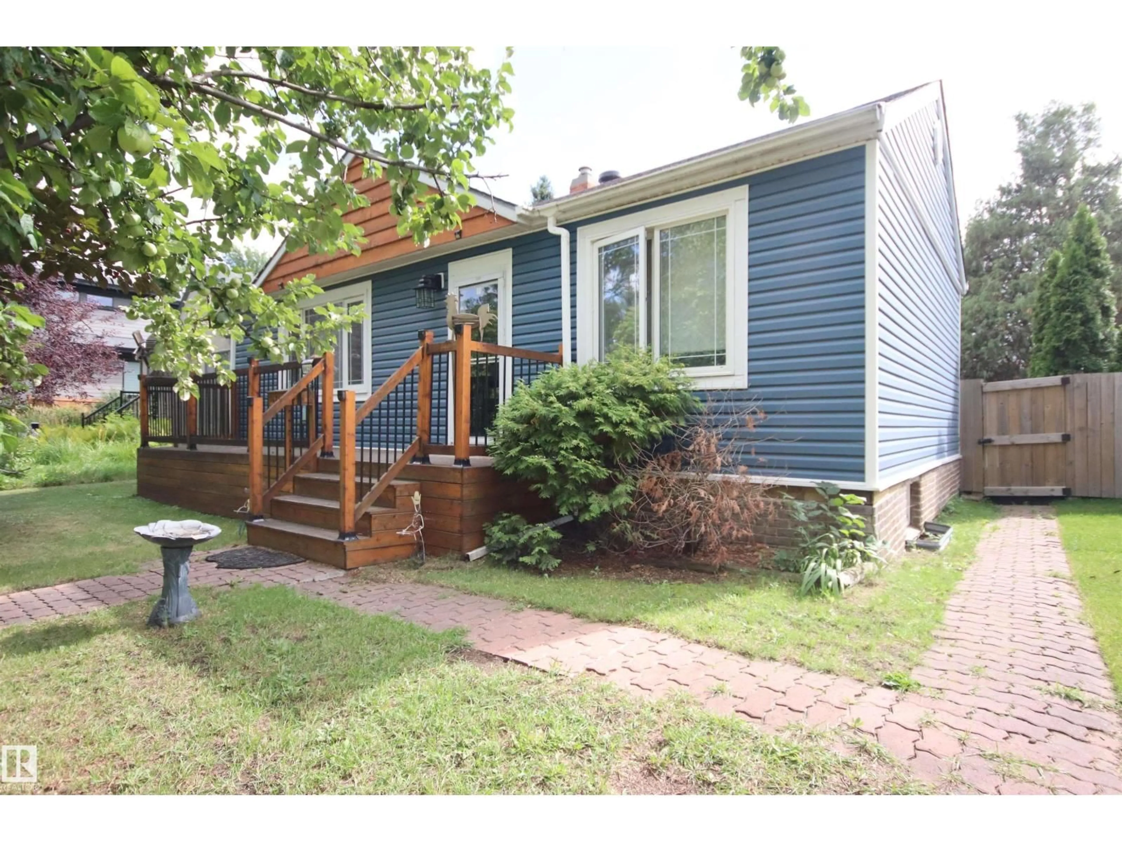 Home with vinyl exterior material, street for NW - 8626 77 ST, Edmonton Alberta T6C2L8