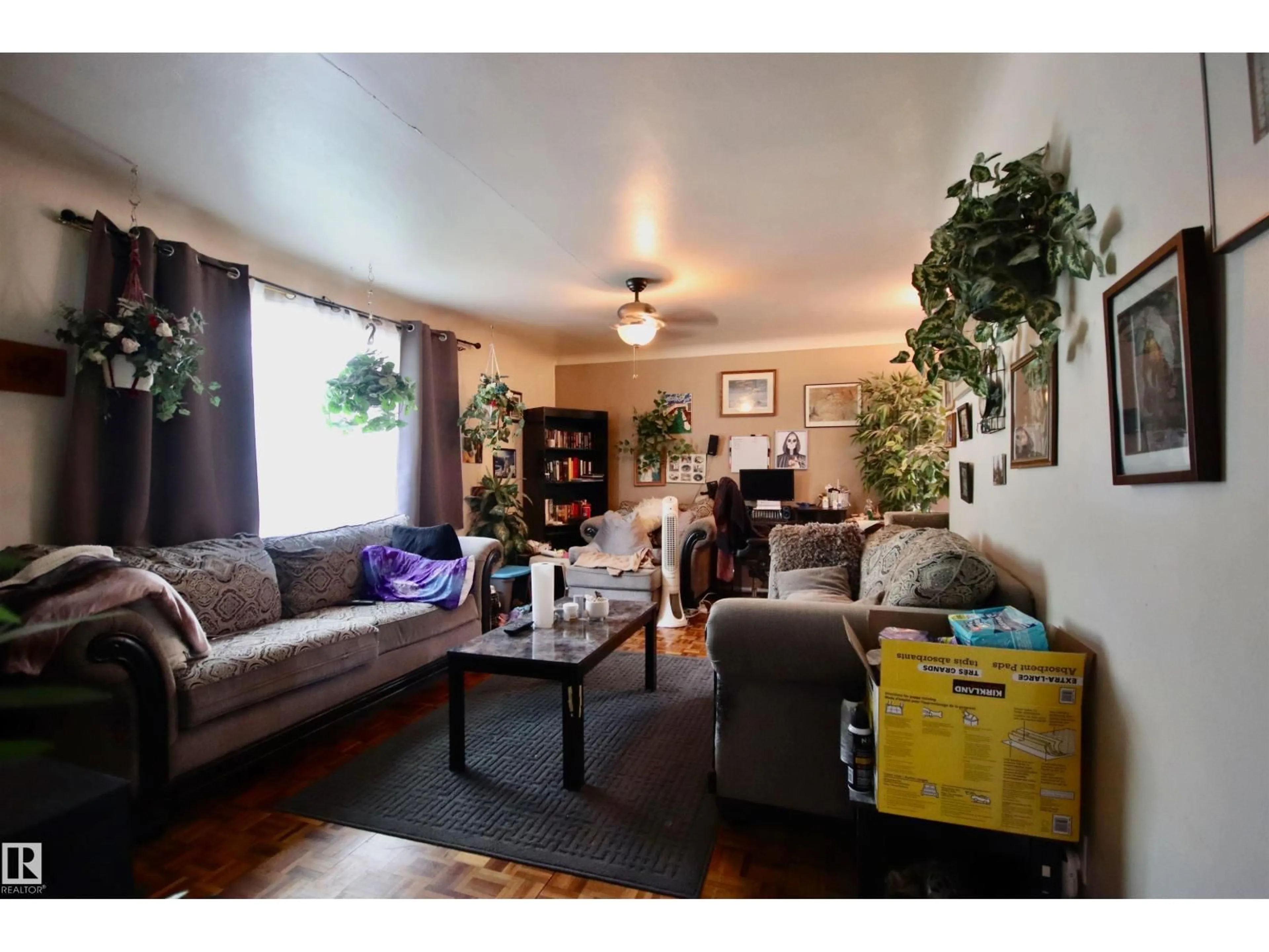 Living room with furniture, wood/laminate floor for NW - 8626 77 ST, Edmonton Alberta T6C2L8