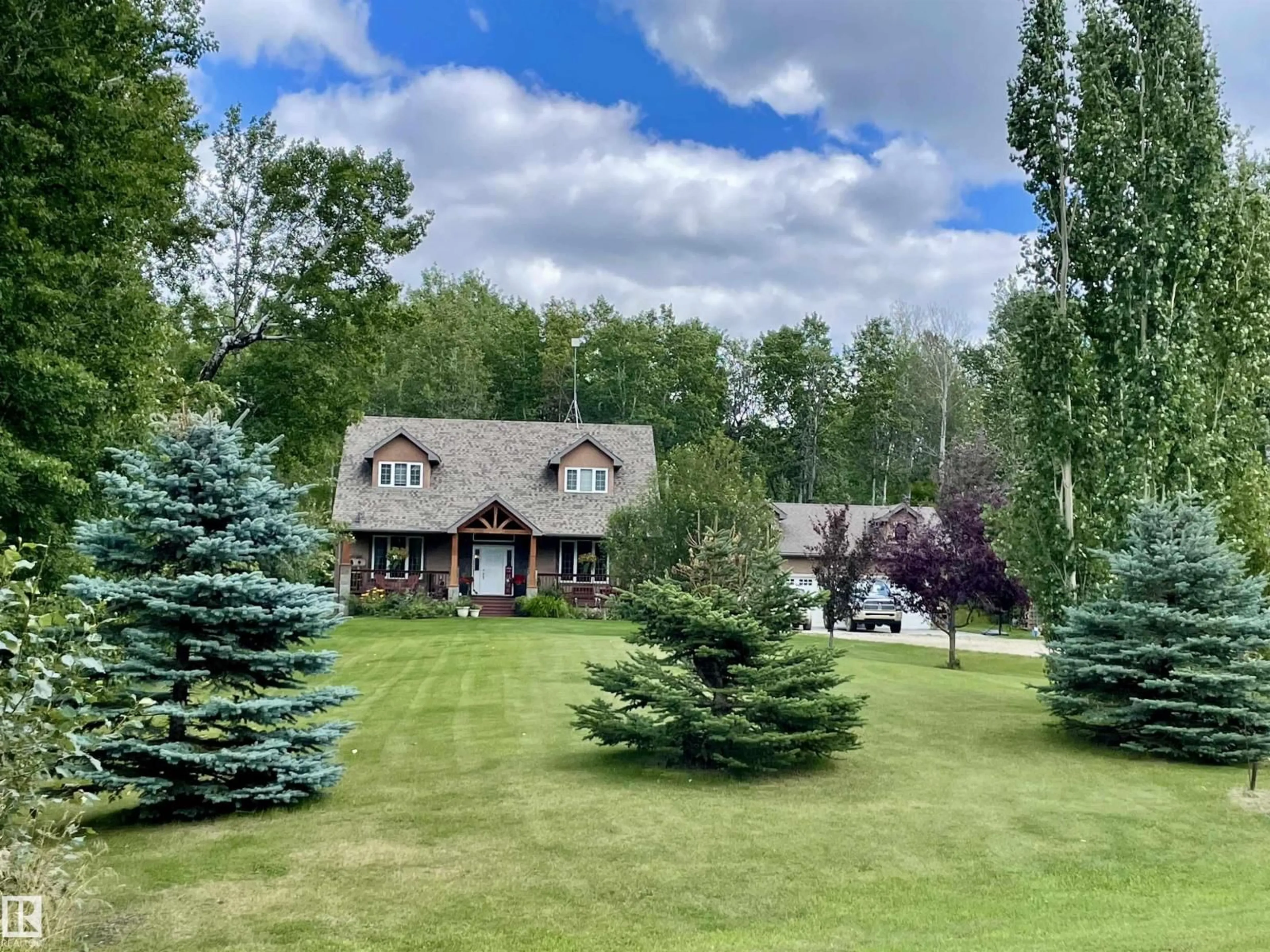A pic from outside/outdoor area/front of a property/back of a property/a pic from drone, mountain view for 34 54419 RGE ROAD 14, Rural Lac Ste. Anne County Alberta T0E1V0