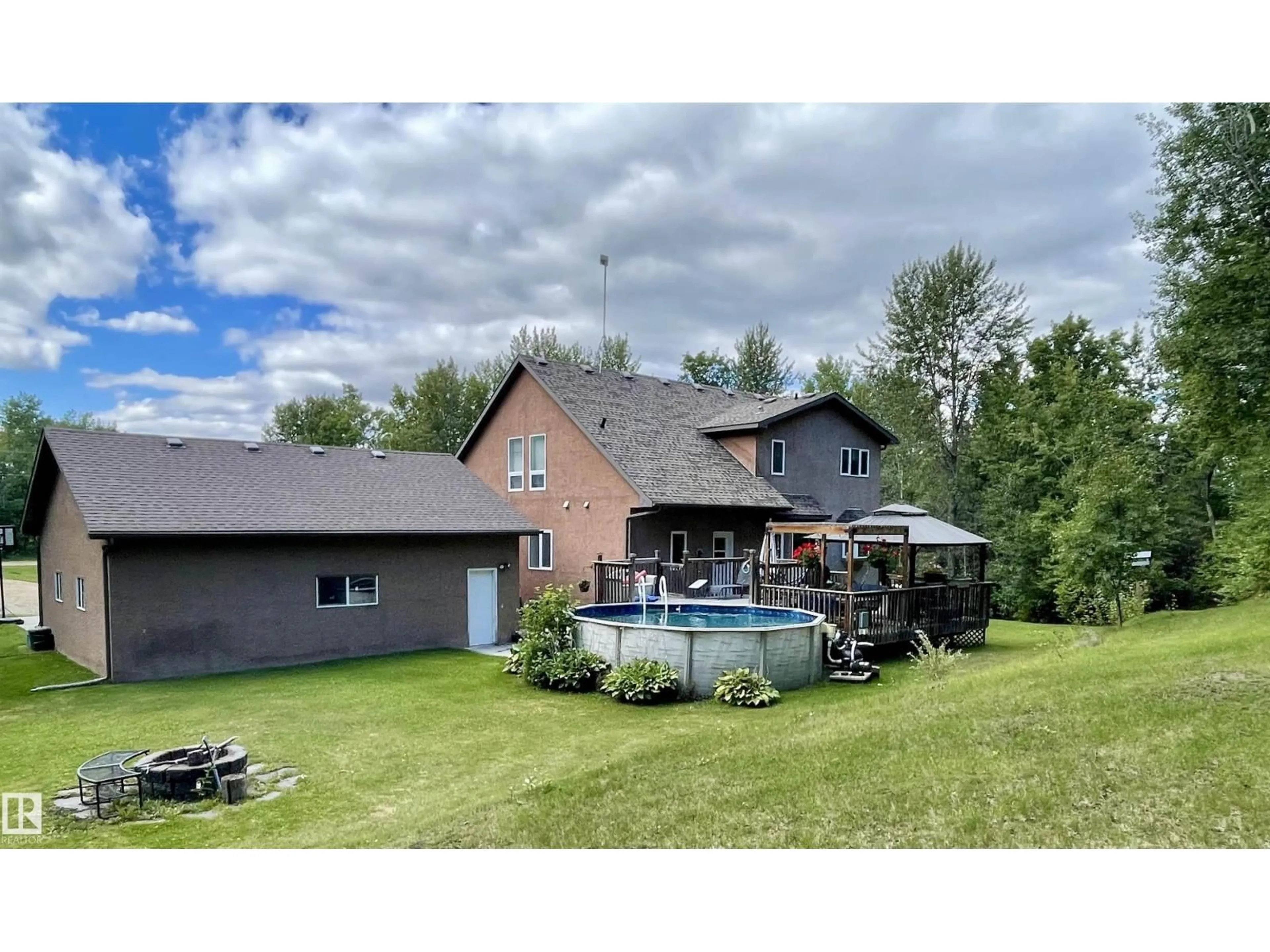 A pic from outside/outdoor area/front of a property/back of a property/a pic from drone, water/lake/river/ocean view for 34 54419 RGE ROAD 14, Rural Lac Ste. Anne County Alberta T0E1V0