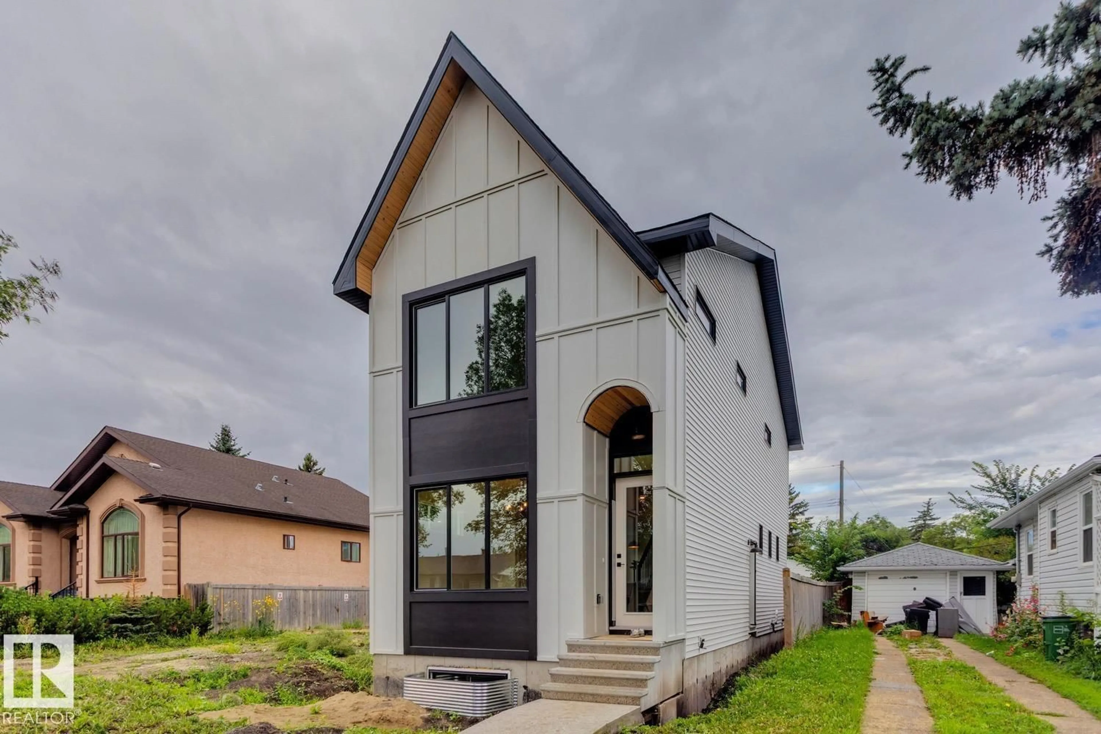 Home with brick exterior material, street for 11336 130 ST, Edmonton Alberta T5M1A2