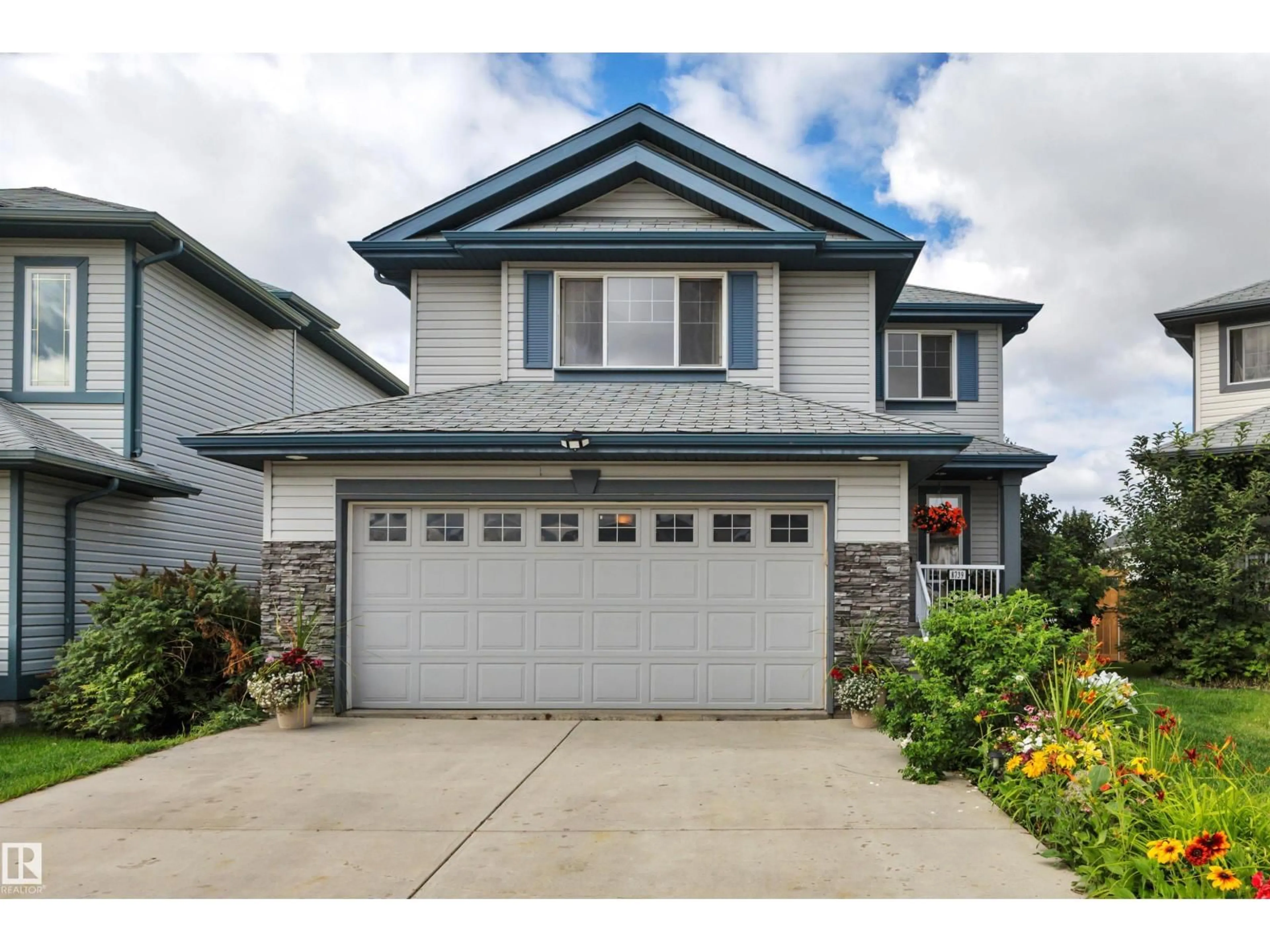 Home with vinyl exterior material, street for NW - 8739 178 AV, Edmonton Alberta T5Z0B8