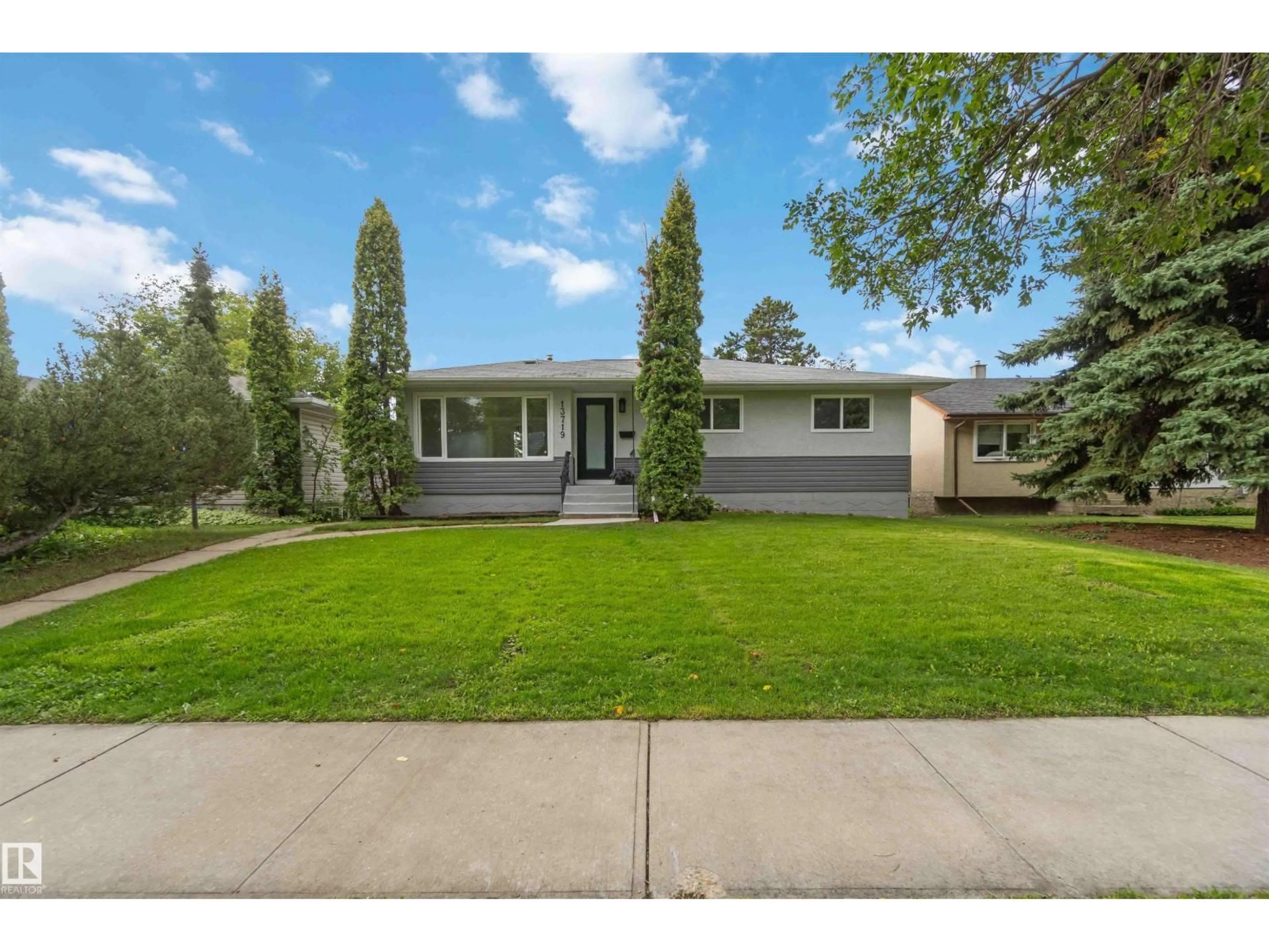 Home with vinyl exterior material, street for 13719 119 AV, Edmonton Alberta T5L2N5