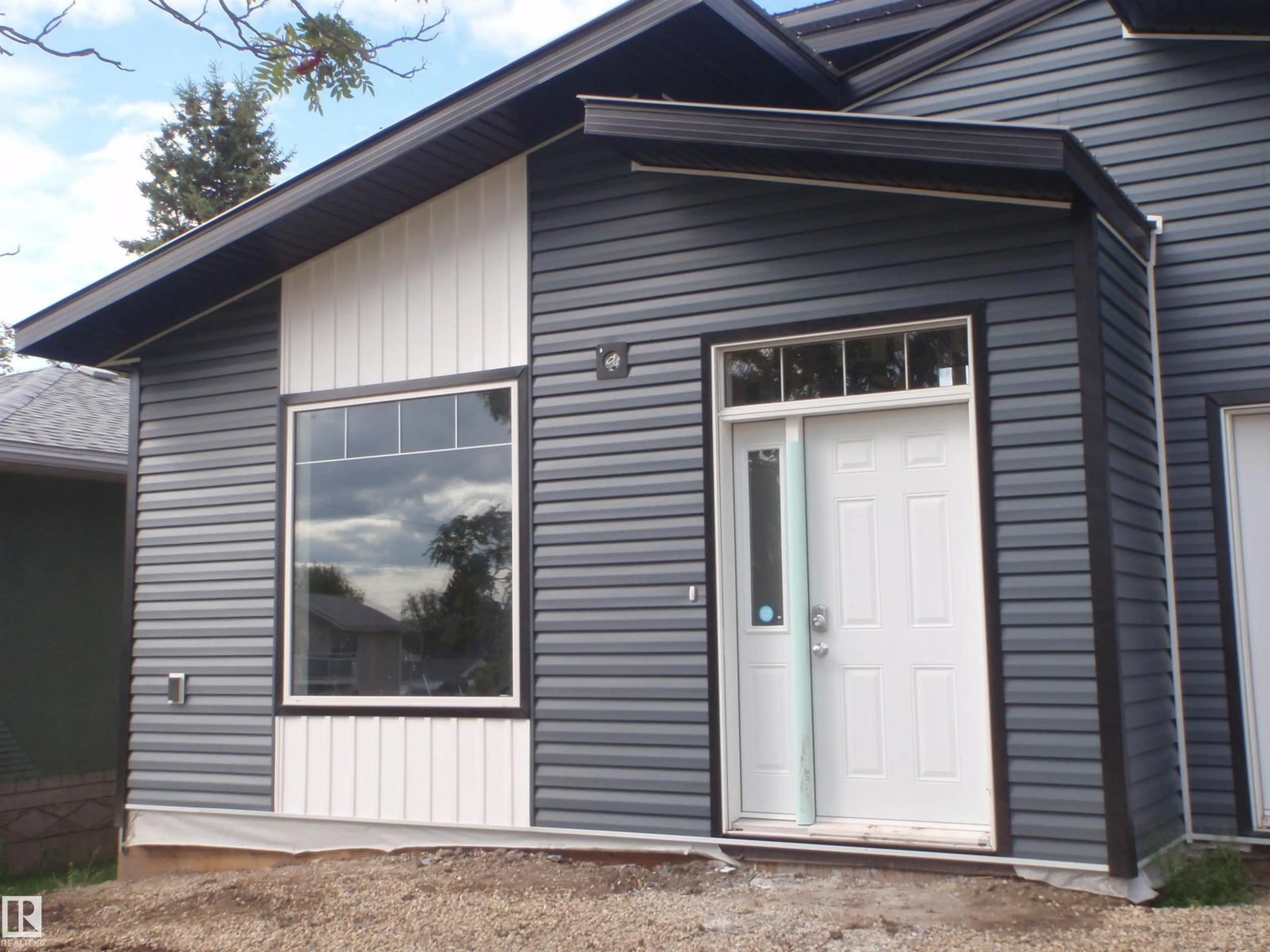 Home with vinyl exterior material, building for 4418 55 AV, Barrhead Alberta T7N1K1