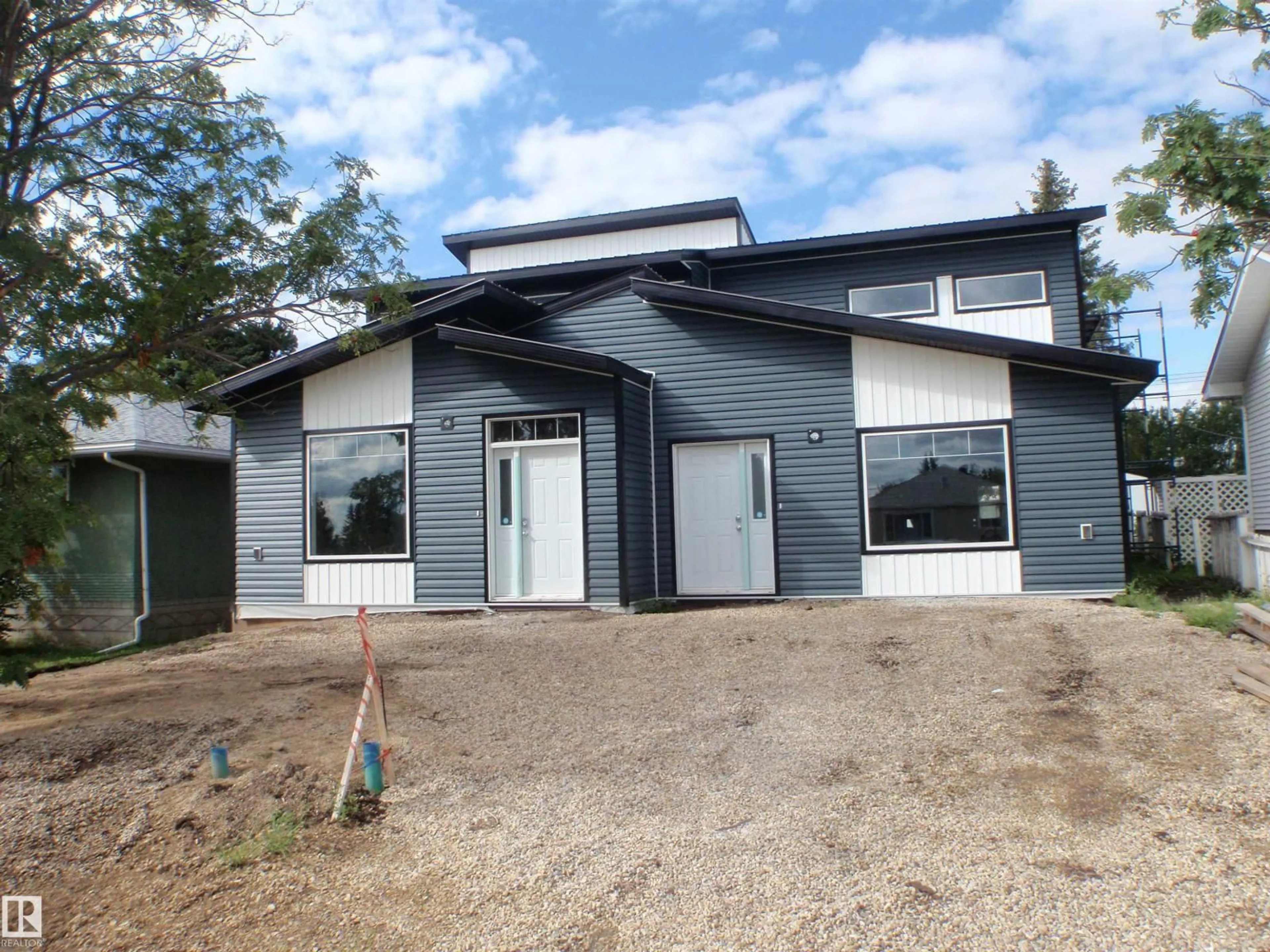Home with vinyl exterior material, building for 4418 55 AV, Barrhead Alberta T7N1K1