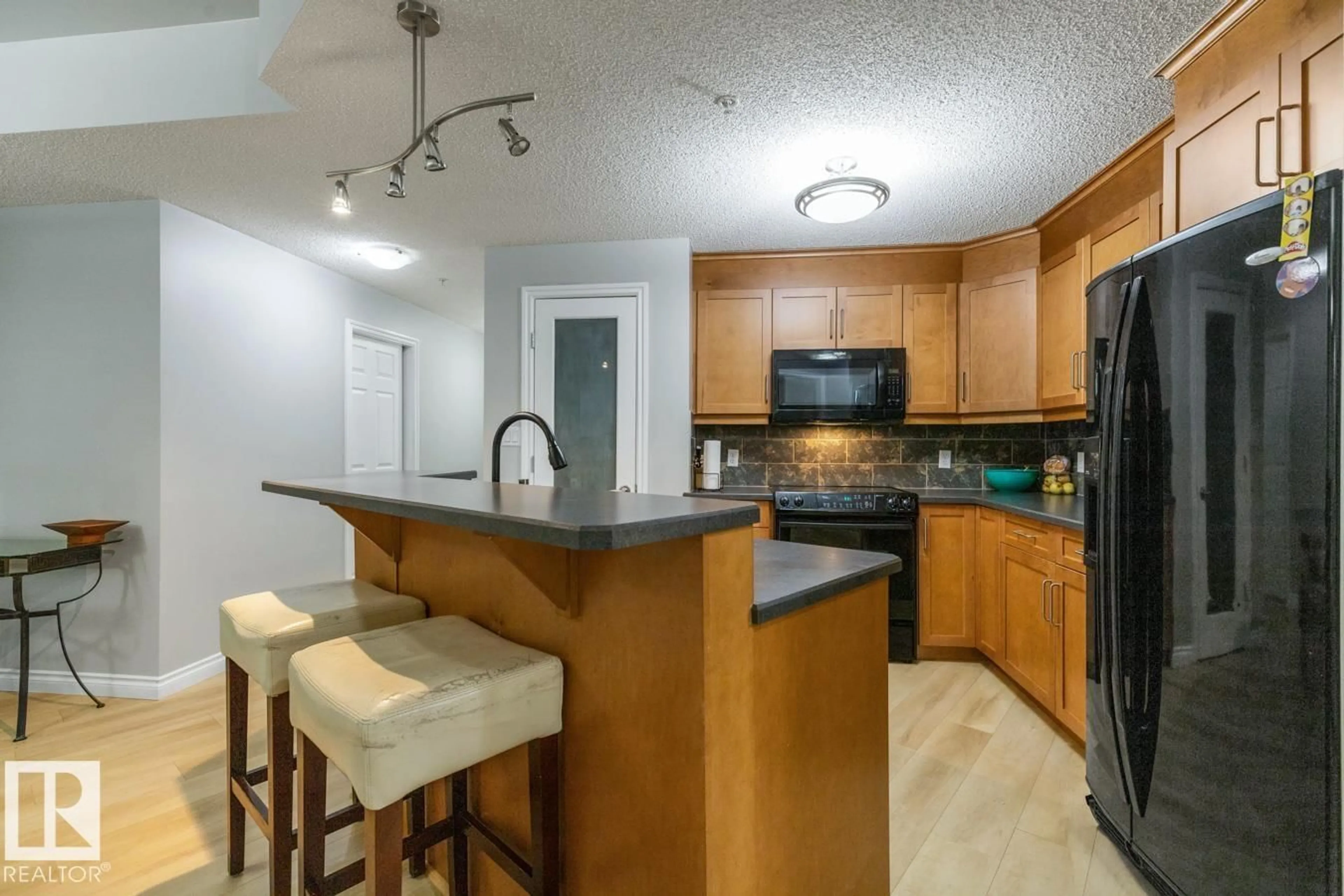 Open concept kitchen, unknown for #402 - 9020 JASPER AV, Edmonton Alberta T5H3S8
