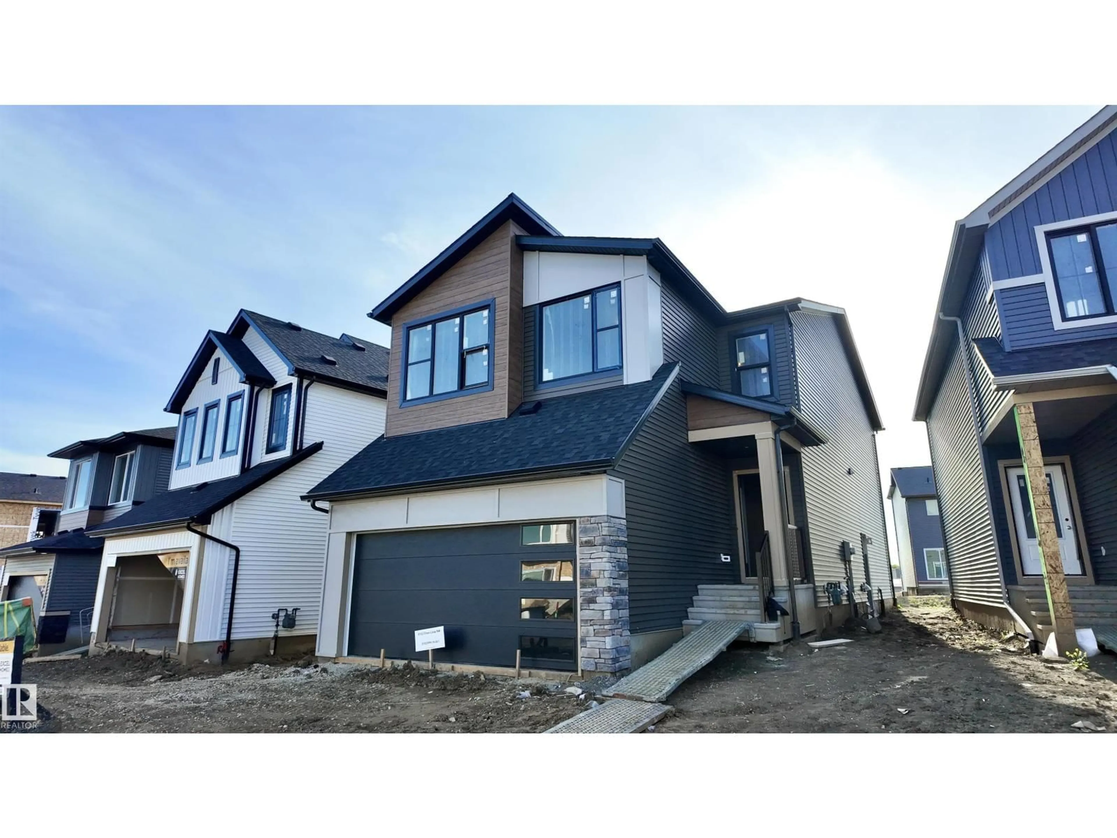 Home with vinyl exterior material, street for NW - 9102 ELVES LO, Edmonton Alberta T6M3G2