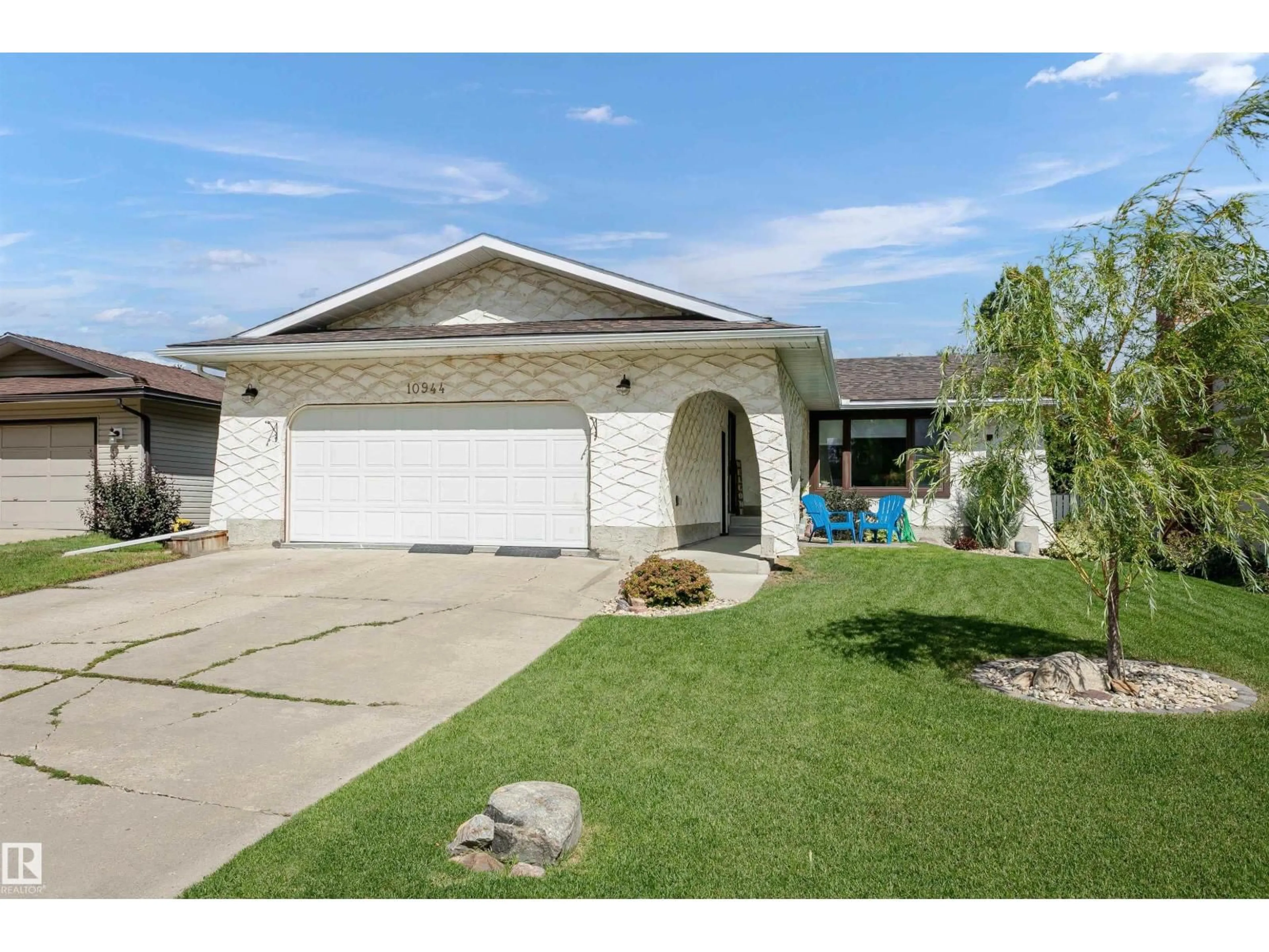 Home with vinyl exterior material, street for 10944 34A AV, Edmonton Alberta T6J2V1