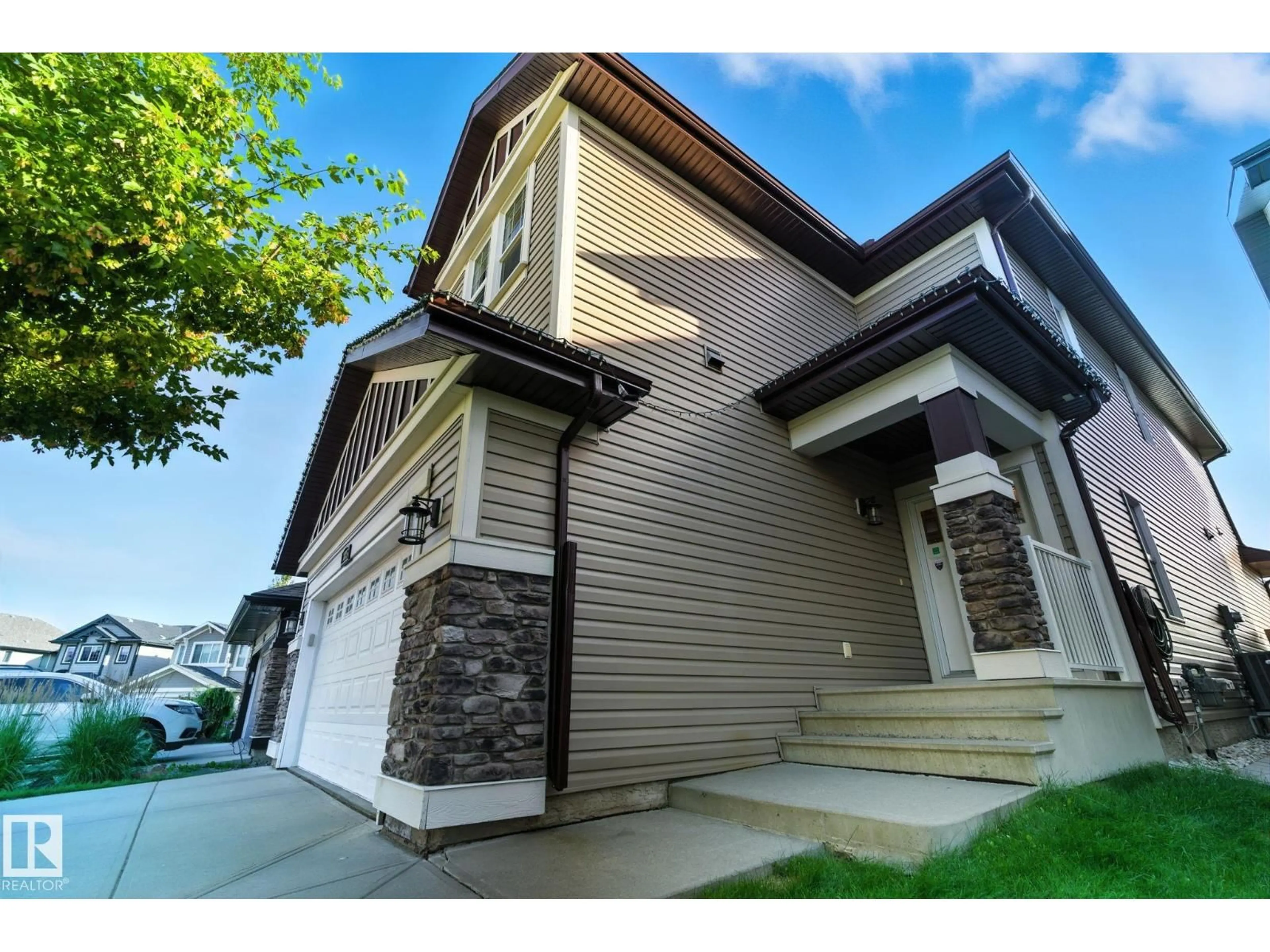 Home with vinyl exterior material, street for 3875 AGAR GREEN GR SW, Edmonton Alberta T6W2G3