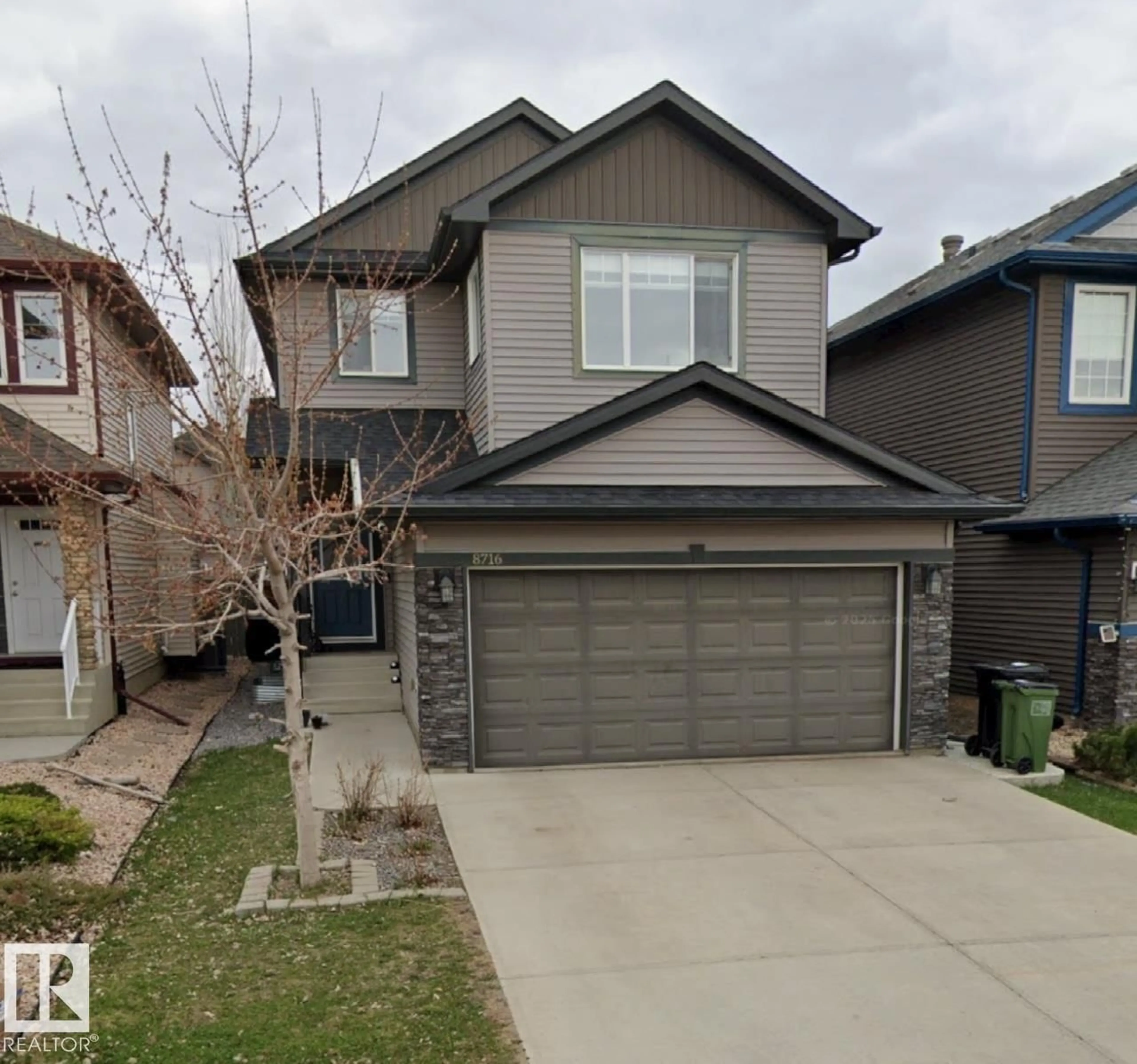 Home with vinyl exterior material, street for 8716 CARSON WY, Edmonton Alberta T6W3K8