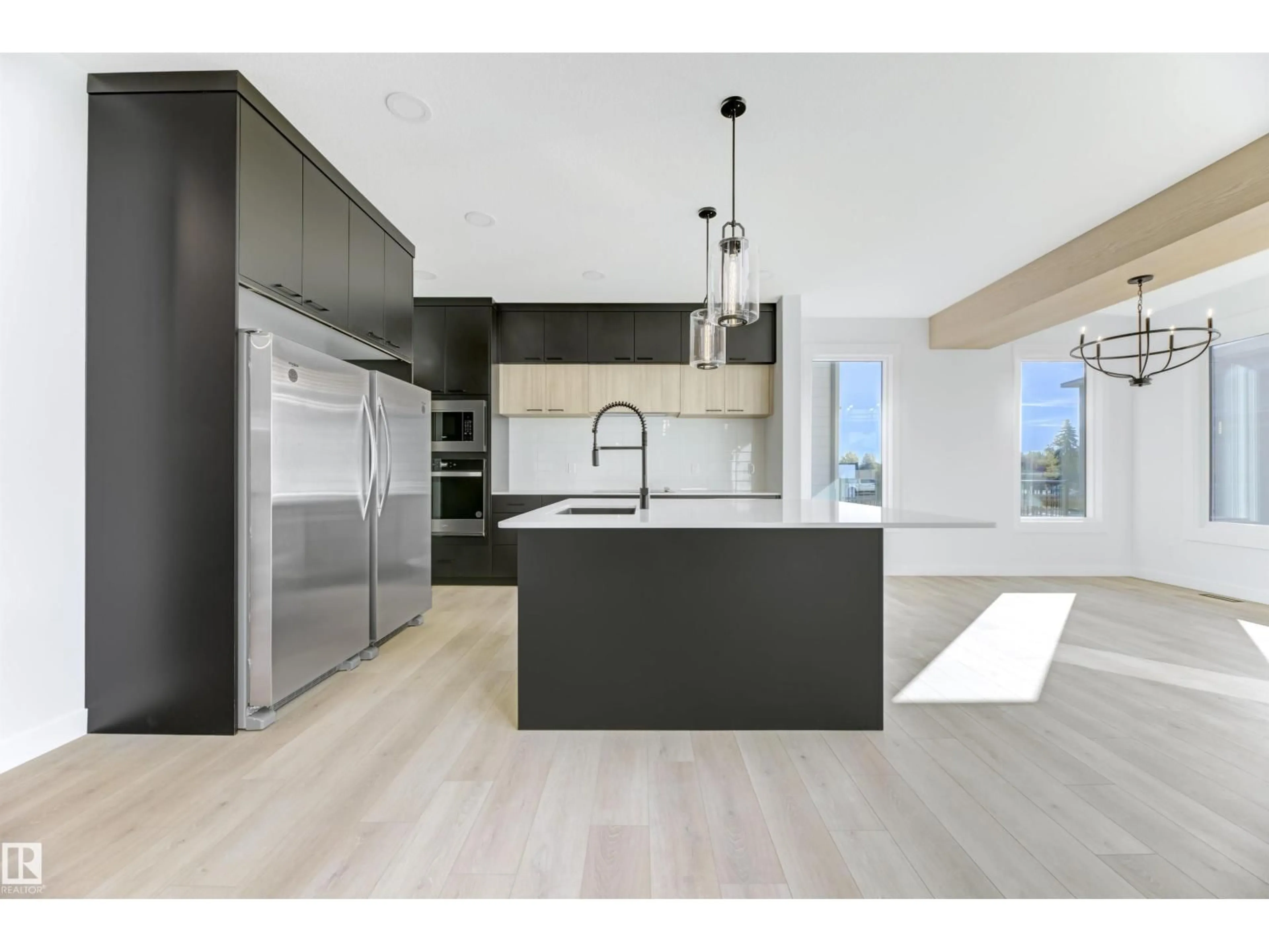 Open concept kitchen, wood/laminate floor for 6953 176A AVENUE, Edmonton Alberta T5Z0W8